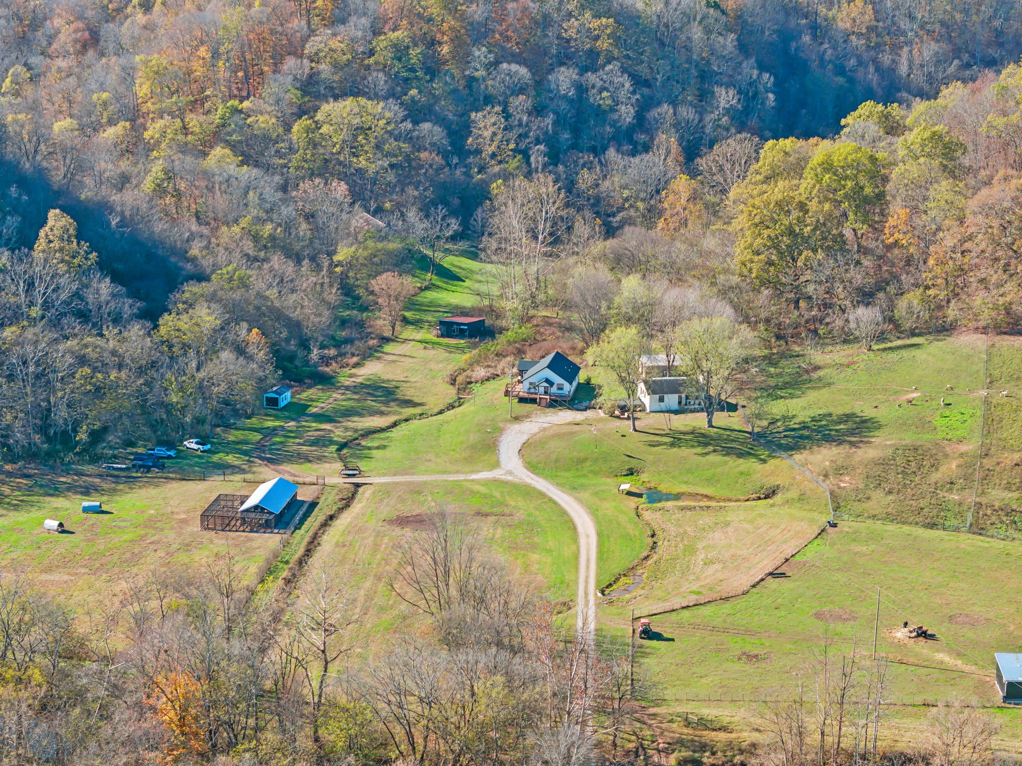 Experience the unmatched natural beauty and versatility of this 338-acre Tennessee farm, ideally located just 20 minutes south of Columbia and a scenic 1.5-hour drive to Nashville. This property is a haven for agricultural, recreational, and equestrian pursuits, with a perfect balance of wooded acreage, open pasture, and natural springs and creeks, including the picturesque Yokley Creek that meanders through the land. Its features are tailor-made for those envisioning a working cattle ranch or equestrian center. A large hay barn, state-of-the-art chicken coop, and fertile land make it ready for livestock or agricultural operations. The property’s extensive trails provide ample space for horseback riding, hiking, and ATV adventures, while its border with Mell’s Foxhound Hunt Club enhances its appeal for hunting and outdoor enthusiasts. This property hosts, a newly built modern 1,400-square-foot home, boasts three bedrooms and two bathrooms, providing a cozy yet stylish retreat. A fully renovated 1,600-square-foot additional home adds flexibility, offering two bedrooms, two bathrooms and two office/flex space—perfect for additional family members, staff, or guests. There are multiple build sites available on this property and no chemicals have been used on the farm under its current ownership making the water from the springs and soil clean and pure. Located off Campbellsville Pike and a mere 8 miles from the charming town of Lynnville, this property offers the best of rural living with easy access to urban amenities. Whether you’re looking to establish a thriving cattle ranch, launch an equestrian center, or simply enjoy the tranquil beauty of Tennessee’s rolling hills and forests, this unique farm is equipped to fulfill your dreams. Don’t miss this rare opportunity to own a slice of Tennessee’s finest countryside, where nature, comfort, and limitless potential come together. Fiber Optic is available.