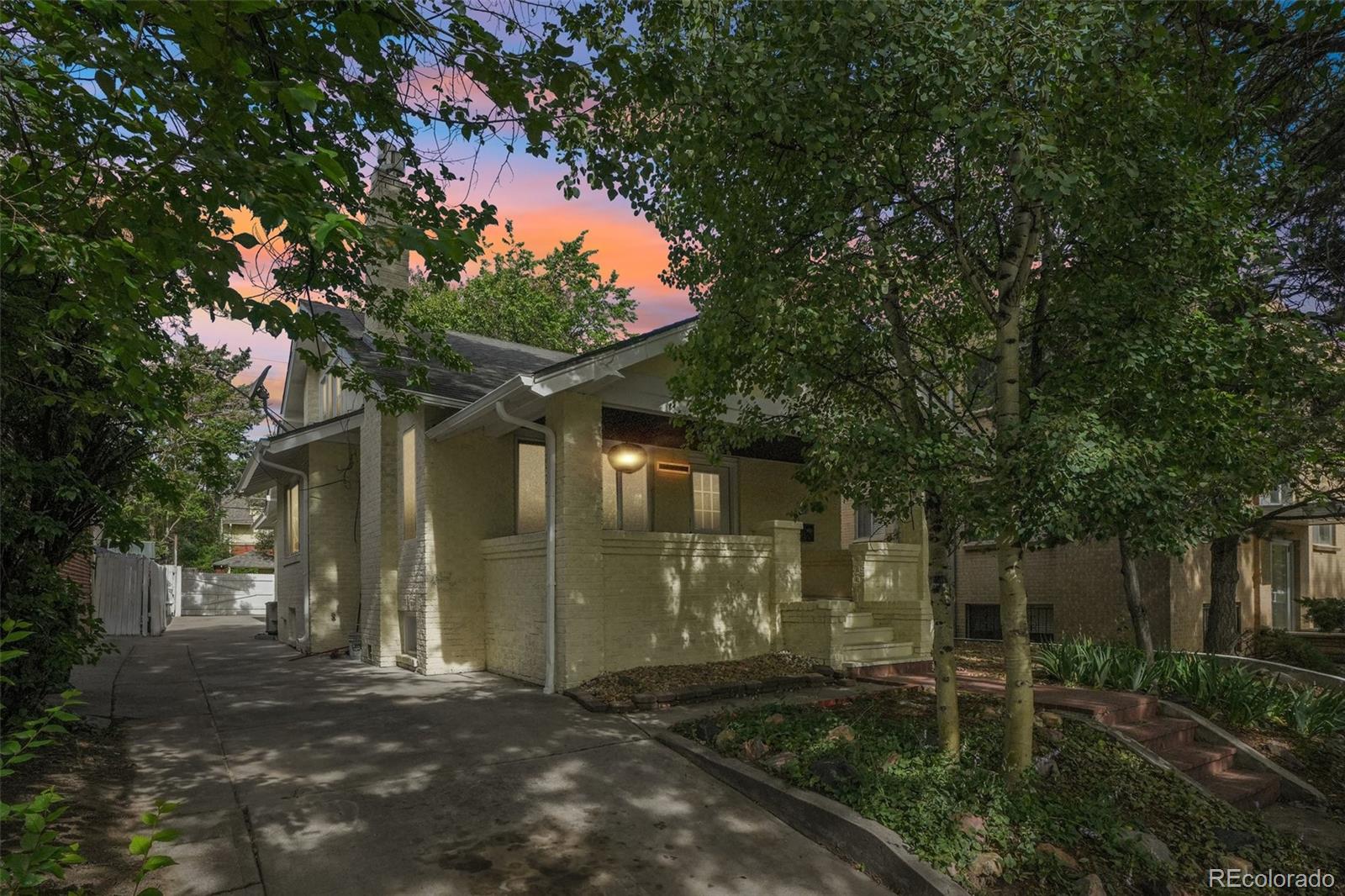 From the moment you arrive, you'll appreciate the charming covered front porch and inviting curb appeal. Inside, the home has been updated with fresh paint, modern lighting, luxury vinyl flooring, and a stunning hardwood staircase with new railings. Vaulted ceilings and a cozy gas fireplace create a bright, welcoming living space.The remodeled kitchen features granite countertops, new cabinetry, a stylish tile backsplash, stainless steel appliances, double sink, wine rack, and updated hardware. A separate dining room provides plenty of space for entertaining.The flexible floor plan includes a private main-level bedroom suite with its own bath, plus two additional bedrooms and a full bathroom with double sinks. A convenient main-level laundry room includes a utility sink.The finished basement offers excellent income-producing or multi-generational living potential with a private entrance, bright living area, kitchenette, gas fireplace, bedroom area, and ¾ bath. Upstairs, you'll find another private suite with its own kitchenette, bedroom, and ¾ bath.With the potential to function as two independent living spaces plus a mother-in-law suite, this property is ideal for investors, house hackers, or multi-generational households.Additional highlights include central air conditioning, updated fixtures throughout, and off-alley parking for 3-4 vehicles.Move-in ready and loaded with possibilities, this Congress Park gem combines historic charm, modern updates, flexibility, and an unbeatable walkable location.