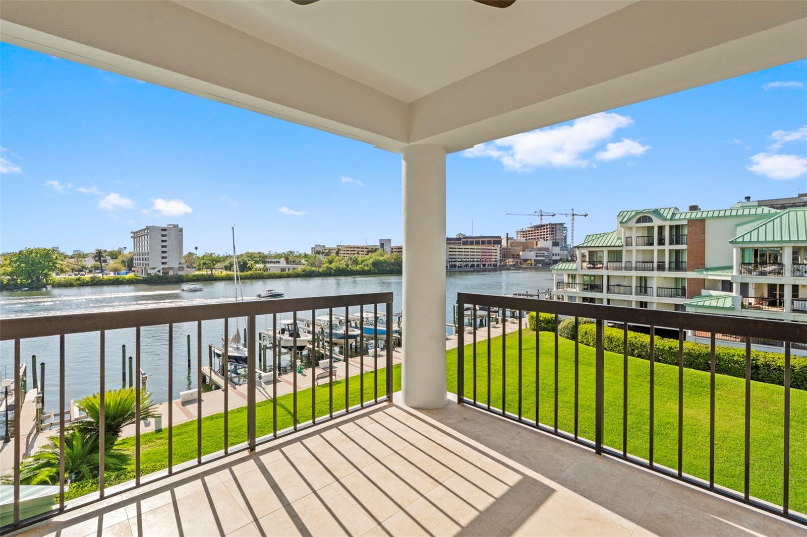 Step into a penthouse condo at Seddon Cove that stands apart from all others. This stunning two-story unit has undergone a complete transformation, creating the ideal environment for entertaining guests and enjoying the best of waterfront living. The interior has been meticulously designed to offer an open floorplan connecting the kitchen, family room, and dining area. Expansive water views are visible from every room, enhancing the sense of tranquility and connection to nature.  Upon entering, you are greeted by soaring ceilings, wide plank wood floors, and an impressive sight line leading to a balcony overlooking the channel. This space provides the perfect vantage point to watch boats pass, dolphins dive, and birds sing. Enjoy the outdoors from any of the four private balconies.  The first floor has been completely reconfigured to enlarge the kitchen, add a dedicated entertainment bar, and relocate the third bedroom to a space with a beautiful view. The chef’s kitchen features custom cabinetry, quartz countertops, a marble backsplash, Monogram appliances, an induction oven, an oversized pantry, and a 90-bottle wine fridge. Choose between a cozy breakfast bar or a larger dining area. The sitting area is ideal for relaxing with friends or savoring sunset views.  Guests will feel right at home thanks to a full bathroom and a secondary bedroom, though they might never want to leave! There are two primary suites, one on each floor, both offering breathtaking views. The first-floor suite boasts an updated bathroom with separate vanities, a walk-in shower, and a spacious closet with a shelving system.  Upstairs, a generous loft provides space for a study or additional gathering area, along with an oversized storage closet perfect for holiday decorations, luggage, and more. The second-story primary suite includes an updated bathroom with a long vanity and dual sinks, garden tub, walk-in shower, and another large walk-in closet.  This home features numerous upgrades, including impact-rated windows and sliding doors, a new roof, new hot water heater, all new appliances, replaced balconies, and a new structural beam to open the space between the kitchen and family room. All assessments and improvements have been addressed, making this residence truly turnkey.  Enjoy the beauty of Harbour Island, living on the water just minutes from downtown while benefiting from the amenities and privacy of a gated community.  You are also steps from the renowned Lifetime Athletic and Tennis complex, making healthy living part of your daily routine.  Additionally there are boat slips currently available for purchase for Seddon Cove residents, making this opportunity even more advantageous!   Your new home is ready—schedule your showing today!