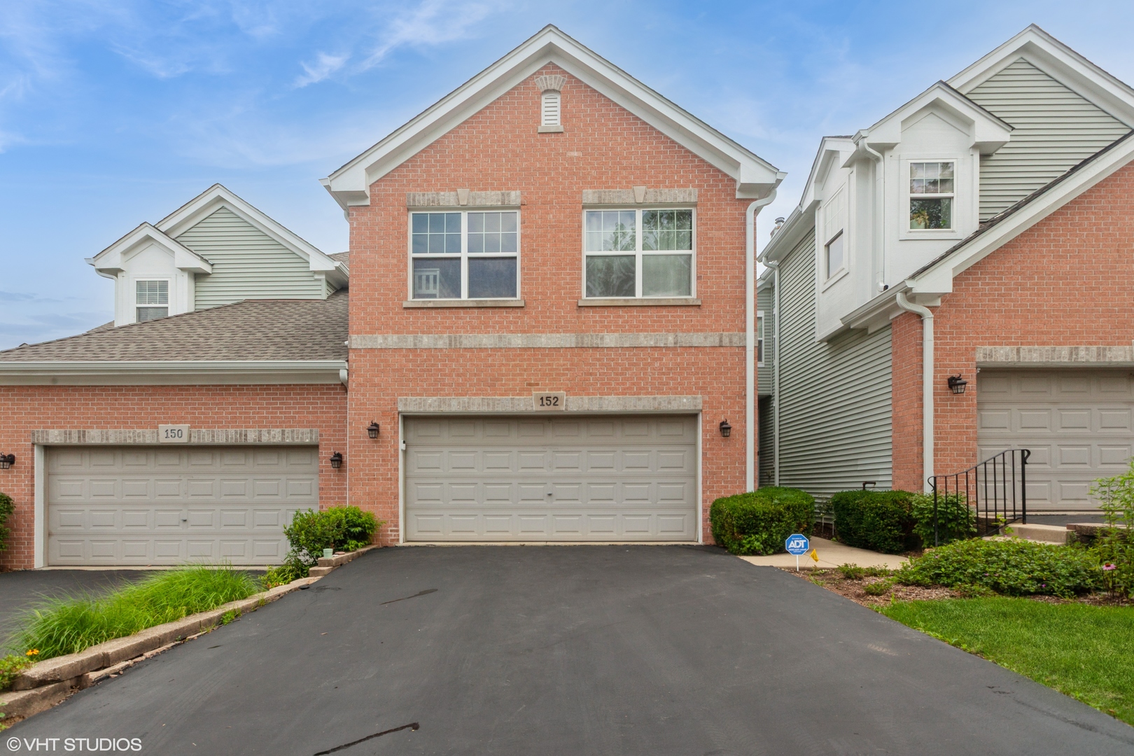 Welcome to this immaculately maintained townhome in the desired subdivision, "The Villas in Hawk Hollow" of Bartlett. This home offers comfort, convenience, and stylish updates throughout. The main level features an open floor plan with hardwood flooring and NEW CARPETING ON THE STAIRS AND IN THE KEY AREAS, UPDATED IN (2022). A BRAND NEW ROOF, NEW TRIM (2024) and FRESHLY REFINISHED DRIVEWAY (2025) provide peace of mind and great curb appeal. WATER HEATER (2020) GARBAGE DISPOSAL(2024) WASHER (2025). The Main level offers an open-concept layout that seamlessly connects the living room, dining area, and kitchen, creating a warm and inviting space ideal for both everyday living and entertaining. Spacious living room features large windows with natural light . A cozy fireplace serves as a central focal point, complemented by built- in media space for functionality and charm. Kitchen boasts granite countertops and oversized 42" cabinets. Positioned conveniently between the kitchen and living room, the dining area offers plenty of room for a full-size dining table. Second level has three bedrooms and a cozy loft area. Master bedroom has a vaulted soaring ceiling with spacious walk in closet and en-suite full bathroom Other two bedrooms also have walk-in closets and adjoining full bathroom in the hallway. Fully finished basement perfect for additional living space or entertainment. HOA pays for the sprinkler system on the property. Located within walking distance to the Bartlett Park District and close to the Metra station, shopping, and scenic prairie paths perfect for biking and walking. A truly move-in-ready home with exceptional features and an unbeatable location.