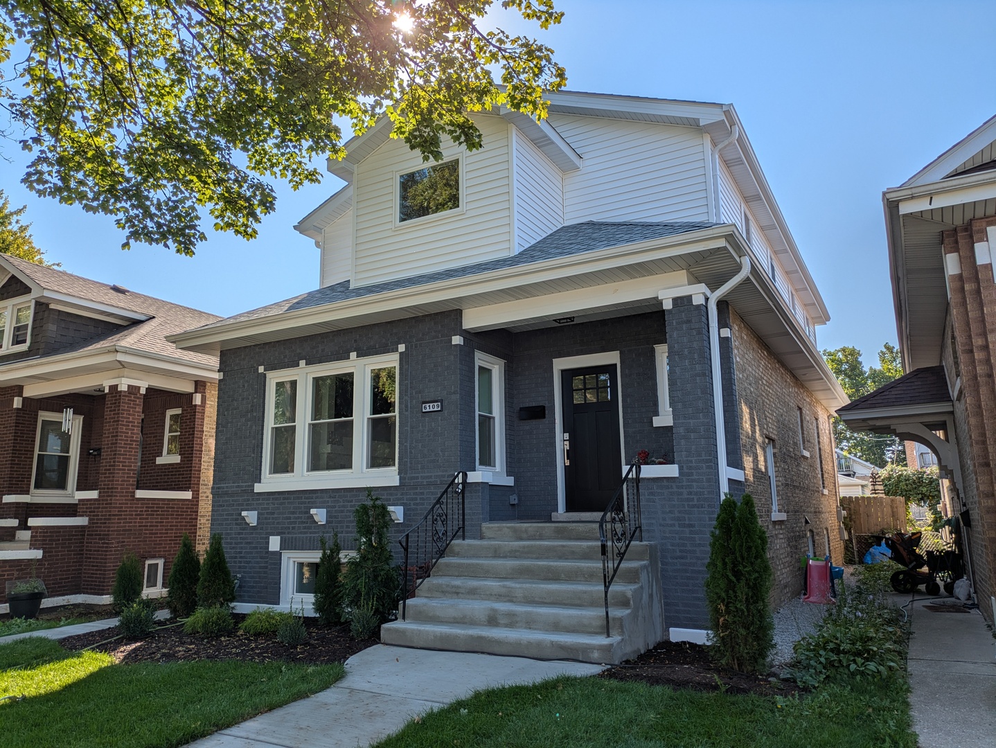 Welcome to the highly sought-after Portage Park neighborhood of Chicago, introducing this beautifully new construction renovated Chicago Bungalow - with almost 3,000 SF of Luxury Living. This 5-bedroom, 4.5-bath bungalow blends classic charm with modern design. The open-concept main floor features custom ceilings, hardwood floors, two fireplaces, a chef's kitchen with oversized quartz island, waterfall edges, full backsplash, and high-end appliances. Dual primary suites-one on the main level and one upstairs-each offer private en-suite baths, while the second-floor addition provides three more bedrooms and two full baths. The fully finished basement, excavated down for higher ceilings, includes a family room with an electric fireplace, wet bar, bedroom, full bath, and laundry. Extensive upgrades include all-new windows, roof, siding, soffits, gutters, concrete, tuckpointing, drain tile system, overhead plumbing, new 1.5" copper water service, tankless water heater, dual HVAC, and 200-amp service. A new deck and two-car garage complete this modernized Chicago bungalow-ideally located near shopping, dining, and convenient highway access. Meticulously rebuilt with city permits and approvals.
