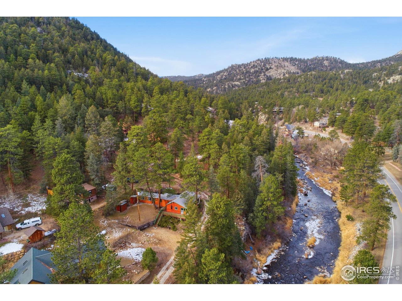 If you've been searching for a mountain cabin that offers more than just a weekend escape-something that feels like a true basecamp for adventure and a place to build lasting memories-this one might stop you in your tracks.Tucked into the Big Thompson Canyon just minutes from Estes Park and Rocky Mountain National Park, this freshly remodeled cabin has everything you need to explore the outdoors and unwind when the day is done. Whether you're casting into the Big Thompson River just steps away, hiking nearby National Forest trails, or taking a scenic drive into RMNP, this is where your mountain lifestyle begins.The covered front deck is where your mornings start slow and your evenings wind down, with nothing but the scent of pine and the sound of the river below. This cabin sits in a spot that offers both privacy and access making it easy to enjoy in every season.Inside, the space is full of character and function. You'll find pine walls, beetle kill trim, and a cozy wood-burning Lincoln stove to warm up after a day outside. The updated kitchen - with classic pine cabinetry - and updated interior mean all the hard work is already done - no punch list, no projects. You can move right in, bring your favorite furniture, and start enjoying the space from day one.With multiple outbuildings, there's room for your gear, tools, and hobbies for fly fishing, backcountry hiking, or just a place to store your snowshoes and tackle box. And the layout of the cabin, while compact, makes room for connection - whether you're sharing a fire with friends or passing this place down to the next generation.This isn't just a mountain hideaway. It's a place to build a rhythm that's slower, more grounded, and deeply connected to the outdoors. A place to come back to, season after season. A place to share with others.If your idea of a good day starts on a trail and ends by the fire, this cabin might be exactly where your next adventure begins.