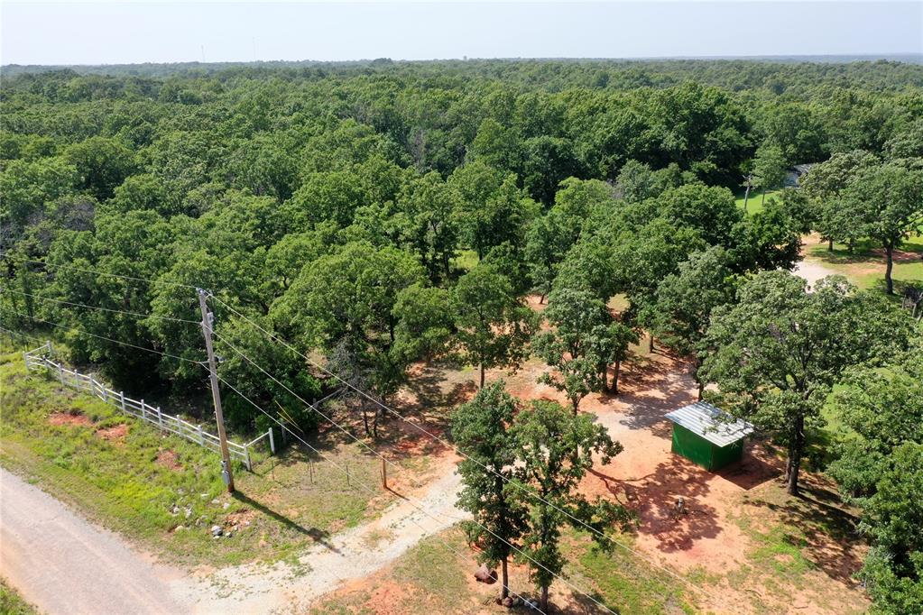Escape to the peace and privacy of country living without sacrificing convenience. This beautiful 5.12-acre homesite offers the perfect setting to build your dream home in a quiet, secluded addition just minutes east of Norman. The property is already equipped with a TWO water wells (DEQ approved), electric service, and high-speed OEC Fiber, saving you time and expense as you begin construction. The front portion of the property has been cleared and leveled, providing an ideal homesite while preserving mature trees and natural surroundings for added privacy.Located just 3 miles from grocery shopping, dining, and everyday conveniences, and only 4 miles from Lake Thunderbird, you'll enjoy the perfect balance of rural tranquility and easy access to recreation, boating, fishing, hiking, and nearby amenities. The commute to Tinker Air Force Base is an easy drive!  Whether you're planning a custom home, a weekend retreat, or an investment in Oklahoma land, this property offers exceptional potential in a highly desirable location.Property Highlights5.12 ± acresCleared and leveled homesitePrivate setting in a quiet rural additionWater well already drilledElectric service available on-siteOEC Fiber high-speed internetMinutes to Lake ThunderbirdApproximately 15 minutes to NormanPlenty of room for a custom home, workshop, barn, or recreational spaceCome experience the freedom of wide-open spaces, beautiful Oklahoma sunsets, and the opportunity to build exactly what you've envisioned—all while remaining close to the conveniences of Norman.