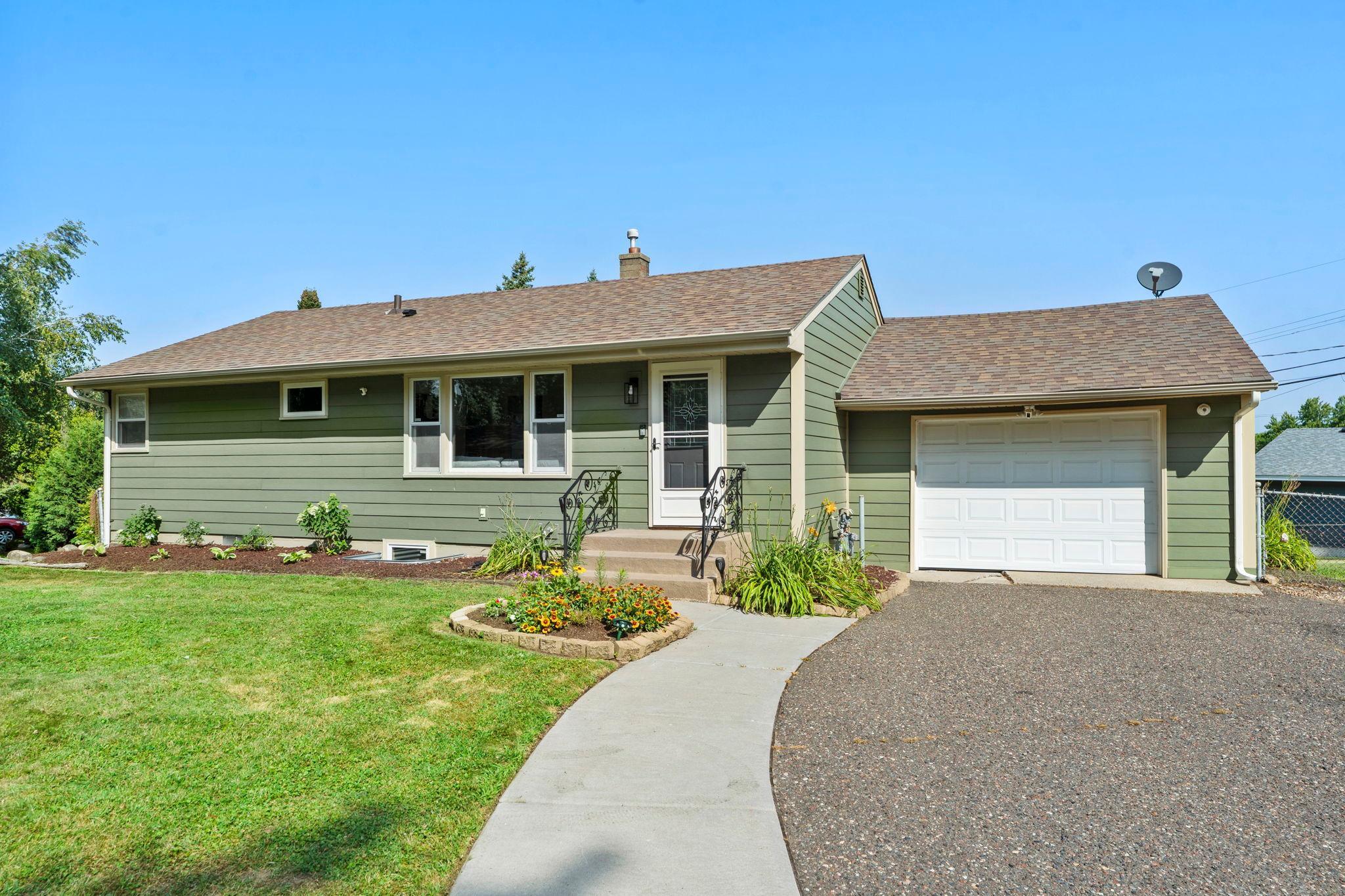 Updated 4 bedroom, 2 bathroom home in White Bear Lake on a fenced corner lot, minutes from downtown shops, dining, schools, college campus, and the lake, with easy highway access.The main level features a bright living room with refinished hardwood floors, a large south-facing picture window, and a Ring security system, plus a dining room with sliding glass door access to the deck and expansive backyard. The updated kitchen includes a stainless steel refrigerator and dishwasher (2025) as well as a gas stove (2026) cabinet pantry, brick backsplash, and access to the garage and lower level.Upstairs, the primary and second bedrooms both have refinished hardwood floors and natural light, with a ceiling fan in the primary. The main floor bathroom is remodeled with tile flooring, a single vanity, and a tub and shower with tile surround.The finished lower level includes a family room with an accent wall, a third bedroom with a walk-in closet, and a fourth bedroom with laundry access. The updated 3/4 bathroom features new tile, a walk-in shower, and laminate flooring.Ample storage space throughout and a backyard shed. Recent updates include new electrical, lighting, carpet, tile, paint, and landscaping throughout (2026), new water heater (2025), attic insulation (2022)  HVAC (2018) new roof and siding (2017).  Washer, dryer, and freezer convey.