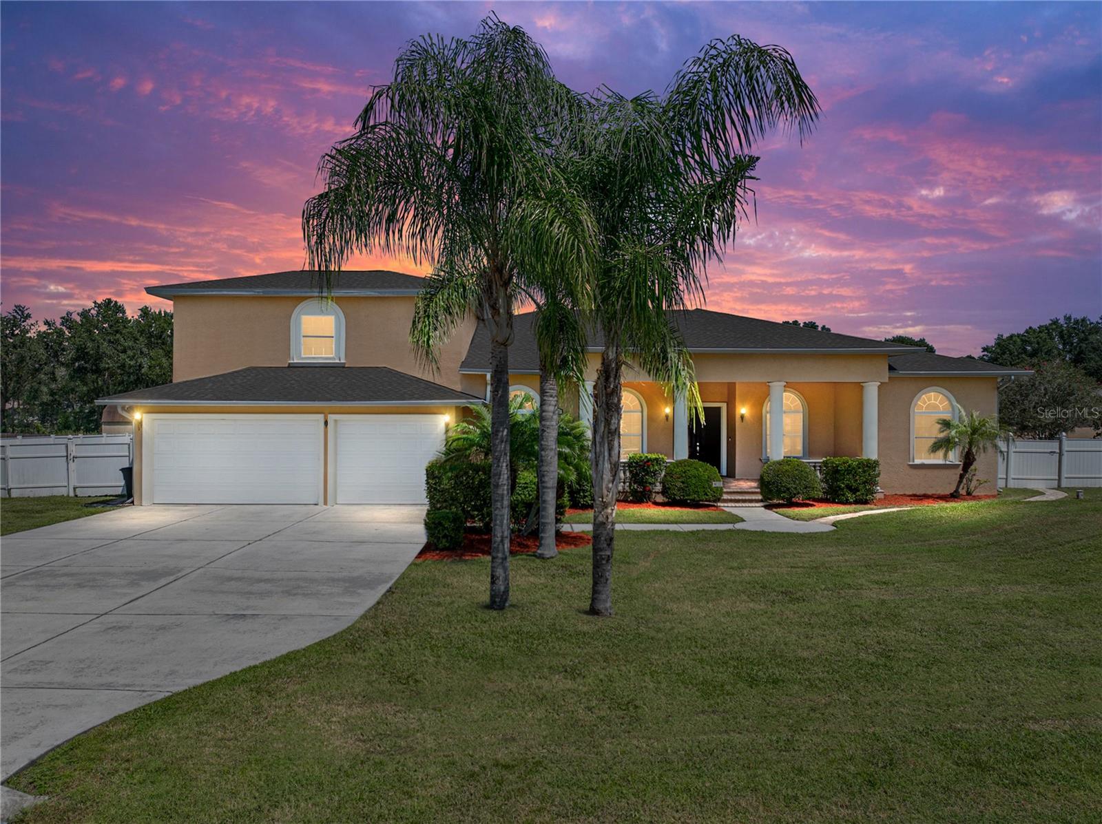 IT’S A PERMANENT VACATION AT THIS MASTERPIECE STAYCATION FAMILY COMPOUND! With more than 9,100 square feet under roof, 6,319 square feet of living space, and a setting on just over an acre with no HOA, it is a property designed to impress at every turn. The main home unfolds with 4 bedrooms + an office, 4.5 baths, a 3 car garage, and a theater room, while a detached cabana extends the possibilities with two complete apartments, each with its own kitchen and bath. Altogether, the estate provides 7 bedrooms, 6 full baths, and 2 half baths, ideal for multigenerational living, long-term guests, or private rental suites. Curb appeal makes its statement first: mature landscaping, a front porch wrapped in pavers, and solid poured columns that speak to the craftsmanship within. Step inside and the details reveal themselves, travertine tile floors, soaring ceilings, light-filled living spaces, and French doors that open to the pool terrace. The kitchen anchors the heart of the home with granite counters, custom cabinetry, a walk-in pantry, and sightlines that connect seamlessly to the family/game room. Here, a full wet bar with a wine refrigerator, and a set of French doors blends the indoors with the outdoors, making entertaining effortless. A formal dining room framed with columns, and a half bath/laundry room with its own dog washing station, add touches of sophistication and practicality. The primary suite is a sanctuary of its own, with French doors leading to the pool, a walk-in closet, and a spa-like bath with dual vessel sinks, vanity seating, a jetted tub, and an oversized shower. The remaining bedrooms are thoughtfully placed: two sharing a Jack-and-Jill bath for convenience, and another positioned privately near the entry. Upstairs, a theater room with a wet bar, a full bathroom, and a bonus flex space offer yet another level of excellence. The detached cabana feels like a pair of private homes, each with its own personality. One offers two bedrooms with an open living and kitchen design, while the other provides a one-bedroom + office with its own updated kitchen and full bath. Together they create unmatched flexibility, perfect for in-laws, extended stays, or additional income. Outdoors, the estate comes alive. The pool and spa are the centerpiece, complete with waterslide, grotto seating, and a cascading waterfall. Surrounding it, a series of spaces invite every form of gathering: an outdoor kitchen with dual grills and refrigerators, a basketball court, fire pit, and multiple covered patios that make alfresco dining second nature. Beyond, a fish-stocked pond and a landscaped courtyard with a central fountain add quiet moments of relaxation. This is not just a home- it is a destination. A property that offers grand scale and intimate detail, where every space is carefully curated for comfort and beauty. Rarely does a residence capture so many lifestyles within one address, and rarer still in such a desirable Wesley Chapel setting with no HOA. Give us a call today to learn more about this one-of-a-kind exceptional estate.