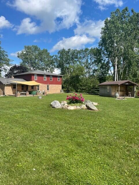 12 Acres, Workshop & Horse Farm, Grand Ledge Schools Home is in a private setting with 3 bedrooms, 8 rooms, 3 1/2 baths, and 102x120 pole building that contains a 4,000 sq ft heated shop with radiant heat, 23 concrete horse stalls w/loft and water supply, additional storage and parking south side. This property also has a 12x24 Sauna/tiki hut with a wood burning stove, changing room, deck and fire pit.  House and buildings are located about 600 ft from road, and the property is located in a 2-mile block, no neighbors behind you and it provides walking trails, privacy and wildlife.  Six (6) acres are leased to a local farmer, has many fruit trees, wildlife, great sunsets, irrigated garden, fire pits and a pond.   And conveniently located near Meijer and schools.  House h