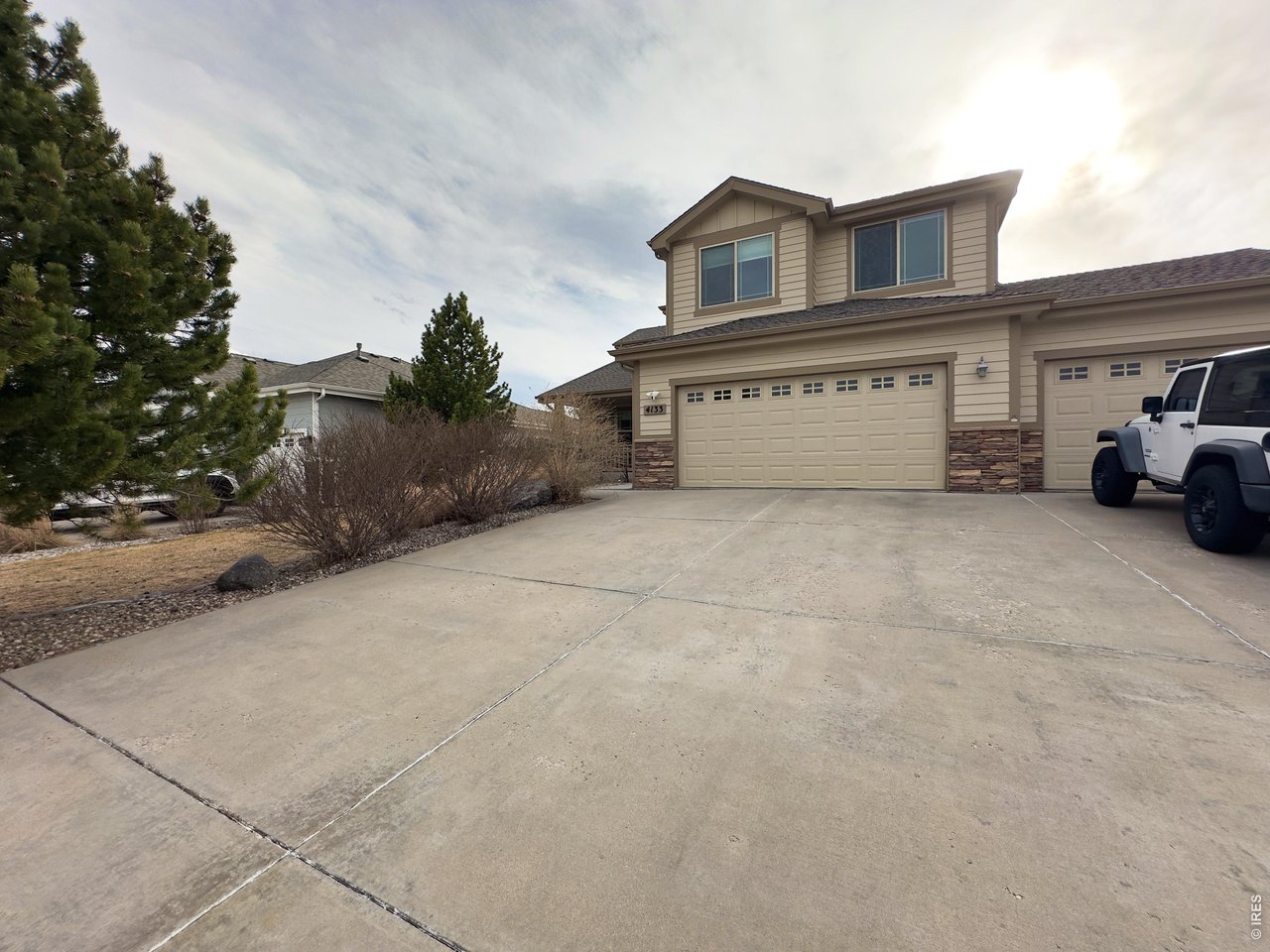 Located in a highly sought-after west Fort Collins location, this home offers easy access to neighborhood trails, natural areas, shopping, dining, and outdoor recreation, including nearby Horsetooth Reservoir. Desirable location, functional floor plan, and spacious design, this property presents an exceptional opportunity to enjoy the best of Fort Collins living.This beautiful home is tucked away on a quiet cul-de-sac in the desirable Gates at Woodridge neighborhood in southwest Fort Collins. The spacious two-story residence offers a thoughtfully designed layout with generous living areas, abundant natural light, and flexible spaces perfect for both everyday living and entertaining.Step inside to a welcoming entry that opens to a bright formal living room featuring a vaulted ceiling and hardwood floors, creating an inviting focal point for gatherings. The eat-in kitchen is designed for both function and style, offering ample cabinet space and an adjacent dining area and informal living room.The main level also includes a half bath and a generously sized laundry room. Hardwood flooring runs throughout the main level, with tile at the front entry, garage entry, half bath, and laundry room.Upstairs, hardwood flooring continues throughout and leads to a well-appointed primary suite offering a private retreat complete with a spacious en-suite bathroom, separate tub and shower, and a tiled walk-in closet. The upper level also includes a loft area with a built-in desk, three additional bedrooms, and a full tiled bathroom.The finished basement expands the living space even further and features a recreation room, game room, wet bar, a fifth bedroom, a 3/4 bathroom, and ample storage space that could also serve as a second laundry area.Outside, the backyard offers a peaceful setting with space to relax, entertain, or enjoy Colorado's outdoor lifestyle. The oversized patio and mature landscaping create the perfect backdrop for summer evenings and weekend gatherings.
