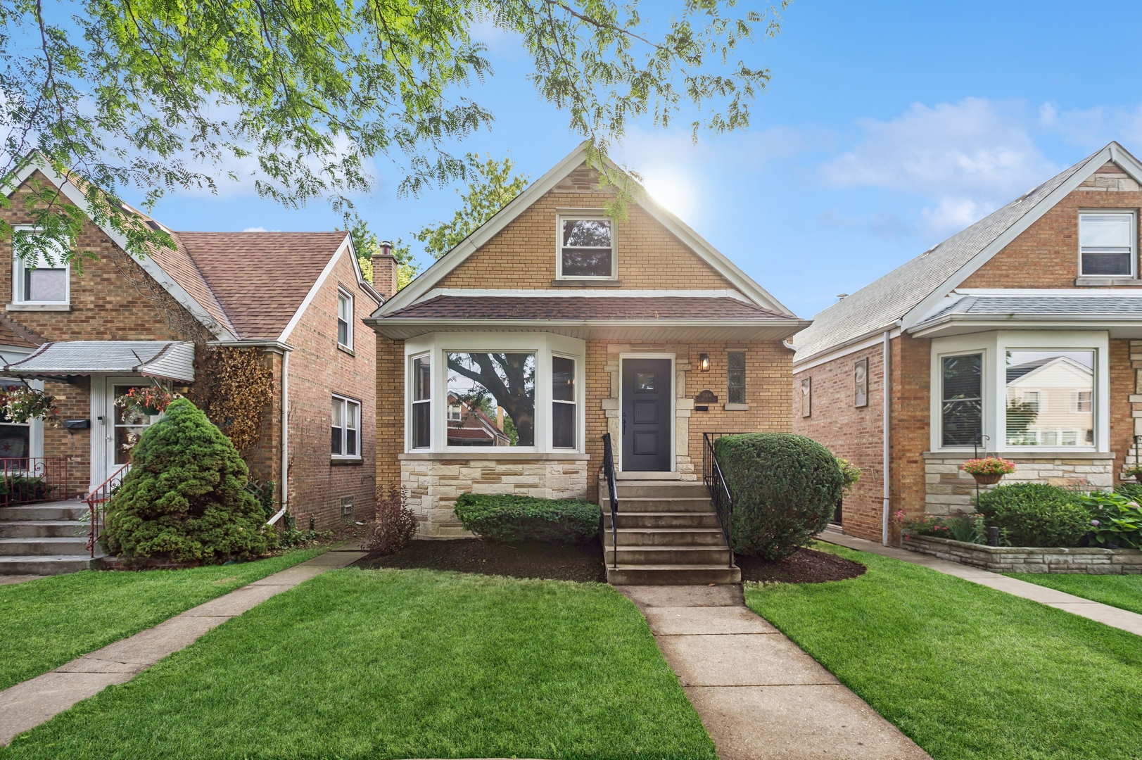 Remodeled 4 bed / 2.1 bath home in the heart of Jefferson Park. This move-in ready home features white oak-stained hardwood floors, vinyl windows, newer roof, and spray foam insulation for energy efficiency. The main level offers a spacious living room, two bedrooms, and a full bath. The gut renovated eat-in kitchen includes quartz countertops, white cabinets, stainless steel appliances, and a stylish subway tile backsplash. A finished porch off the kitchen adds additional living space. Upstairs, you'll find two more bedrooms and a convenient half bath. The fully finished basement with exterior access includes a large family room with wet bar, full bath with walk-in shower, with laundry area, and plenty of storage. Additional features include new HVAC, new condenser, new garage, and all new mechanicals, copper plumbing, 100 amp electrical service with updated panel. Excellent location near parks, shopping, public transportation, and expressways. A rare find that combines quality finishes with thoughtful design.