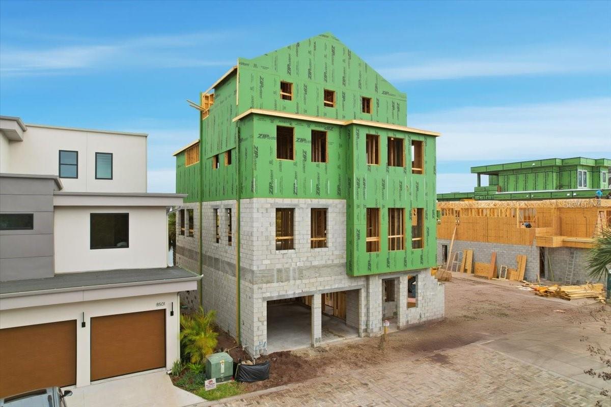 Under Construction. Your BRAND-NEW Waterfront Custom home in Laureate Park, Lake Nona with Elevator and 4 STORIES of gorgeous high-end finishes, outdoor living from every floor, and an incredible location in the heart of the neighborhood, by Talbot Custom Homes.  This unique 4-story residence features a dramatic open foyer and each level is thoughtfully designed to be utilized in a number of different ways.  From the downstairs lakeside entry and bedroom suite, to the 2nd level with additional primary suite and 2 other bedrooms, flex room and water-views balcony- to the 3rd floor kitchen and luxurious primary bath, there's something for everyone with enough indoor and outdoor space to enjoy in every corner of the property.  Heading up to the 4th level you have an outdoor sun deck to enjoy the florida sunshine. Talbot Custom Homes is quickly becoming known for their quality builds all over Orlando with nothing but the best finishes including Thermador appliances, custom cabinetry, designer lighting and beautiful bath fixtures, decorative details, and the ability to customize for each homeowner really sets them apart. Laureate Park's city center with Canvas Restaurant & Market, the LP fit gym, 2 swimming pools at the Laureate Park Aquatic center is just steps away from this home, along with the Lake Nona Town center, 3 major hospitals, the Wave Hotel, and Orlando International Airport located just a few miles to the west. Inquire today about this never-before-seen layout and experience the joy of owning a custom home in Lake Nona.