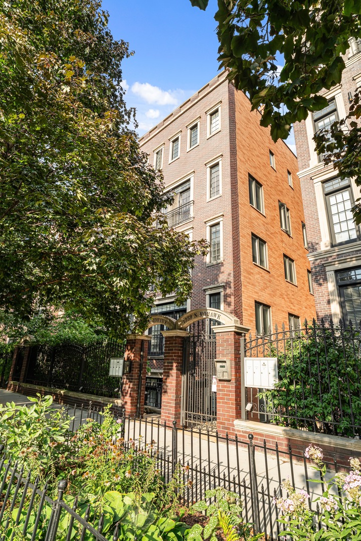 This is THE Old Town 3 Bedroom Condo you have been waiting for. Massive interior space with the preferred extra wide layout plus featuring a private outdoor oasis. This updated 3 bed, 2 bath condo is in an all-brick building offering the perfect blend of comfort and style in the heart of Old Town. The open floor plan is filled with natural light and showcases hardwood floors and crown molding throughout. A welcoming living area features a cozy fireplace, while the updated kitchen boasting brand-new Bosch stainless steel appliances, 42" cabinetry, and natural stone countertops. The expansive primary suite includes a walk-in closet and a completely renovated spa-like bath with double vanities, a walk-in shower, and a separate Jacuzzi tub. Additional highlights include stackable laundry that is easily made side by side, garage parking, and two amazing outdoor spaces-your own 24' x 14' private deck with new composite decking plus access to a shared 32' x 23' garage rooftop deck. All this just steps from the Brown and Red Line, New City, Target, and all the shopping, dining, and entertainment Old Town has to offer. Come tour it today before it's gone!