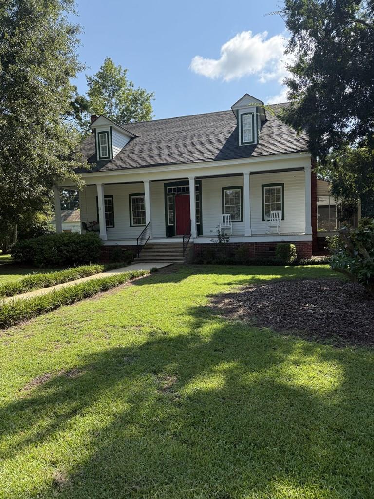 Classic restored farmhouse just outside the city limits of Thomasville! This 4 bedroom, 2 bath home (2,352 sq ft) sits on 1.99 acres of mature trees and shrubs with the feel of being in the country. Updates to the electrical, plumbing, and kitchen as well as 2 AC units. Original wide plank hardwood floors have been restored, and the home has been enhanced with crown molding, tongue and groove ceilings, and updated trim work. Has a really large, screened back porch and a “rocking chair” front porch. There is a 960 square foot guest house with 1 bedroom and 1 bath-great for in-laws or as extra rental income. Currently rented for $850 per month-separate electrical and water connections. Outbuildings for storage. Call for an appointment today!