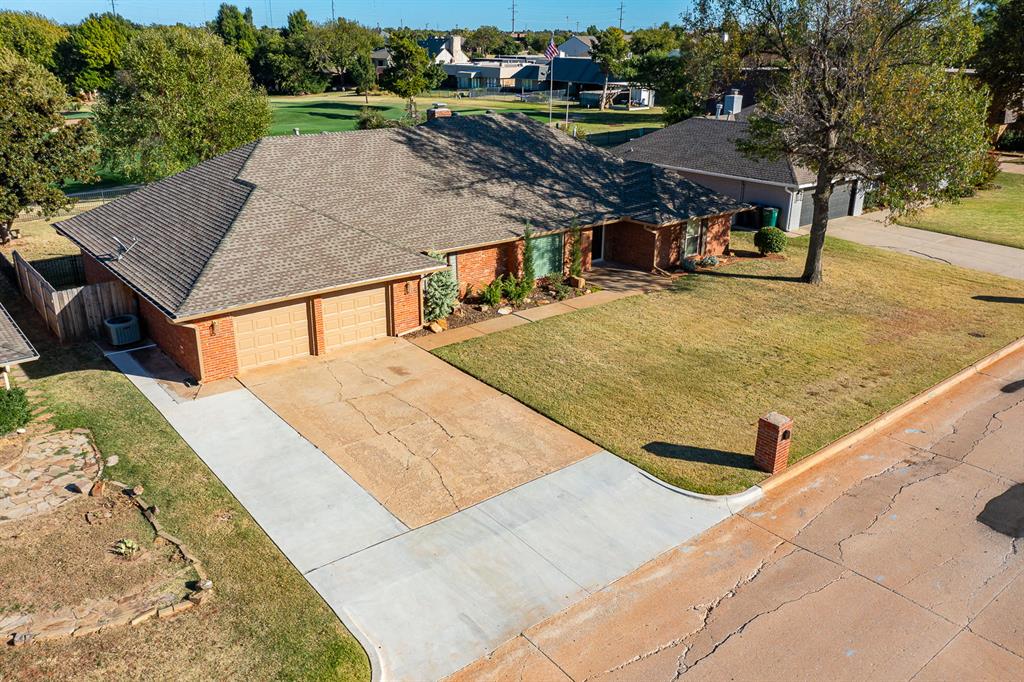 Exceptional Opportunity in The Greens!This beautifully updated one-level, 4-bedroom, 3-bath home is a rare find, offering sweeping views of the 13th fairway at The Greens Golf Course and a spacious, functional floor plan designed for both everyday living and entertaining.The thoughtfully updated kitchen and bathrooms feature modern finishes and custom tile work, while two generous living and dining areas provide flexibility for gatherings or quiet relaxation. The fourth bedroom adjacent to a bathroom with shower, conveniently located off the kitchen, is ideal for multi-generational living, a private guest suite, or a home office.Recent improvements include fresh exterior paint, newly installed gutters, updated plumbing, and a new hot water tank. Step outside to the covered patio, where an electrical hookup is already in place for a hot tub—perfect for enjoying the golf course setting. The home also includes a refrigerator, washer, and dryer, along with two new insulated garage doors and brand-new openers, plus an extra concrete parking pad for added convenience.The location is unbeatable—walk or take your golf cart to The Greens Country Club, with quick access to Mercy Hospital, Kilpatrick Turnpike, Hefner Parkway, and an abundance of shopping and dining.