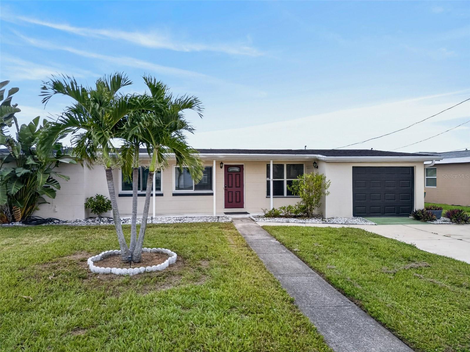 Prime Waterfront Location! Great Investment Opportunity! Updated 3 bedroom, 2 bath, 1-car garage waterfront pool home with powerboat access to Charlotte Harbor leading to the Gulf! Great location with one bridge to open water, 75 feet of waterfrontage, extended wood dock with water and electric plus 8,000 lb. boat lift. New impact windows and slider, electric pool heater and shingle roof in 2023. Step inside to an open floor plan offering large windows providing plenty of natural light, neutral décor and tile flooring throughout. Kitchen features granite counters, light cabinetry, side buffet and overlooks Florida room with pool and water views. Both baths have been updated with new vanities, lighting, fixtures, tile and walk-in showers plus primary bath is handicap accessible. Light and bright Florida room is a great space to entertain and enjoy the water views year-round, rain or shine. Step outside to the large screened heated pool with true southern exposure to enjoy an abundance of Florida sunshine plus there is an outside patio area great for grilling. Incredible location in a quiet residential neighborhood close to restaurants, shopping, schools, beautiful parks and just a short ride to Charlotte Harbor and downtown historic Punta Gorda with arts, community events and entertainment. Don’t miss this opportunity! Schedule your private showing today!