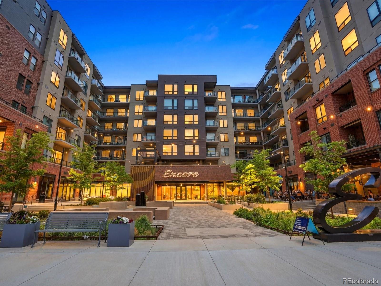 Experience elevated luxury living in the heart of Downtown Castle Rock at Encore, where sophisticated design meets an unmatched walkable lifestyle. Perfectly positioned on the 5th floor, this exceptional residence boasts one of the building's most coveted locations, showcasing breathtaking, unobstructed views of Pikes Peak from your private balcony, an idyllic backdrop for morning coffee, sunrises, & peaceful Colorado evenings. Built in 2021, this beautifully appointed 2-bedroom, 2-bath condo offers effortless elegance with an open-concept floor plan designed for both everyday living and entertaining. The chef's kitchen features quartz countertops, stainless steel appliances, range hood with timeless backsplash, and an island that seamlessly flows into the spacious living area. Floor-to-ceiling windows flood the home with natural light and include electric shades throughout. Retreat to the luxurious primary suite, where you'll wake each morning to picturesque Pikes Peak views. The suite includes a generous walk-in closet and a spa-inspired ensuite bath. A second bedroom and full bath provide the perfect accommodations for guests, a home office, or additional living space. Encore delivers a true lock-and-leave lifestyle with secure building access, resort-style amenities including a state-of-the-art fitness center, expansive outdoor hot tub, golf simulator, pet wash station, fire pits, & beautifully maintained common spaces. An assigned parking space is conveniently located on the same level as the unit, allowing direct access without stairs or elevators. Step outside and immerse yourself in the vibrant Downtown Castle Rock. Enjoy boutique shopping, award-winning restaurants, coffee shops, entertainment, grocery options, and local favorites like Block & Bottle, the Emporium Market, Rec Center, Festival Park, and farmers market, all just moments away. This is more than a home; it's a lifestyle defined by luxury, convenience, and the very best of Colorado living.