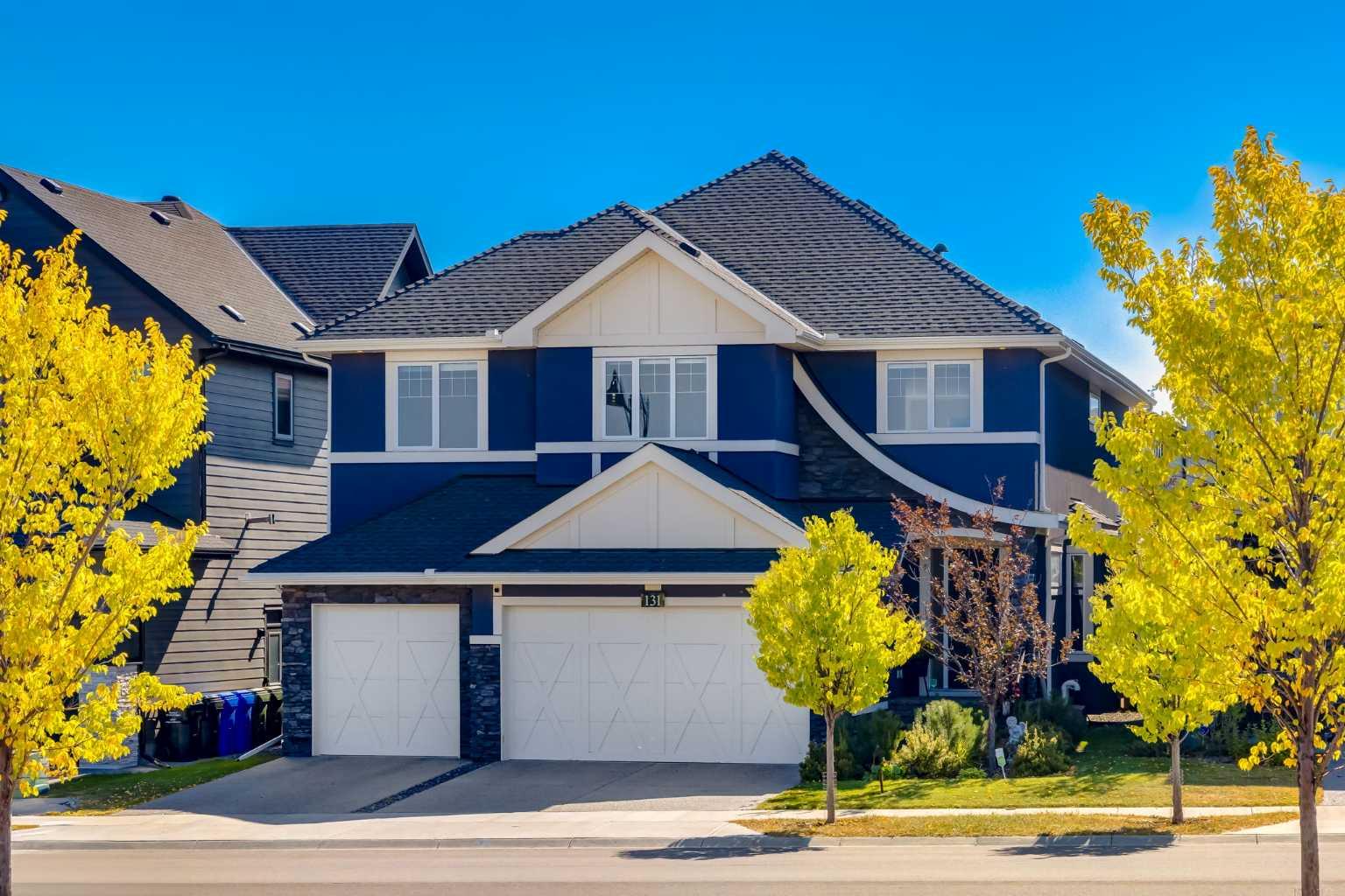 OPEN HOUSE SATURDAY SEPTEMBER 20TH, FROM 2PM TO 4PM.  Experience this exceptional modern family residence, perfectly situated in the prestigious SW community of Aspen Estates. Built in 2019, this exquisite home offers over 4,400 square feet of developed living space and features a stunning, private, and professionally landscaped backyard retreat. The outdoor oasis is complete with lush greenery, mature trees, an outdoor fireplace and a convenient gas line for entertaining friends and family. Inside, the residence showcases a thoughtfully designed layout with four spacious bedrooms and beautiful details throughout. The gourmet kitchen is a chef’s dream, appointed with top-of-the-line appliances including a five burner Wolf gas cooktop, custom Faber hood fan, dual Miele ovens, and an oversized integrated fridge and freezer. Timeless quartz countertops, a gorgeous white tile backsplash, an expansive walk-in pantry, and a welcoming breakfast bar make this space perfect for busy mornings and family meals. A versatile main floor den offers the perfect option for a home office or playroom, while the formal dining area shines beneath a striking crystal accented chandelier and detailed coffered ceilings. The heart of the home is the inviting great room, anchored by a floor-to-ceiling white stone gas fireplace and framed by soaring dramatic ceilings. A sweeping curved staircase leads to the upper level where the serene primary suite awaits in its own separate wing. Boasting vaulted ceilings, a romantic double-sided fireplace, and beautiful south sunshine streaming through the sheer draperies. The primary suite also features a spa-like ensuite with heated porcelain floors, a luxurious soaker tub, steam shower, double vanities, and a make-up desk. Two additional bedrooms and a cozy bonus room provide ample space for family living, while the conveniently located upstairs laundry room adds ease and practicality to daily routines. The lower level is designed for both relaxation and entertaining. Indulge in the sleek wet bar adjacent to a climate-controlled wine room, host family movie nights in the spacious family room, or focus on wellness in the dedicated home gym. A large bedroom, full bathroom, and generous utility room complete the lower level. Additional highlights include a triple car garage offering exceptional storage and an artificial turf backyard.  Aspen Estates is an unbeatable location just minutes from Calgary’s top private schools, boutique shopping, and an array of amazing restaurants and amenities. This residence is more than a home. It is a perfect blend of modern luxury, comfort, and timeless design, ideally suited for family living.
