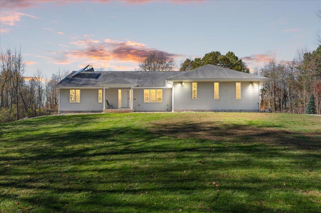 This beautiful, custom-built executive ranch sits atop nine secluded, densely wooded acres, offering exceptional privacy and natural beauty. The home features a spacious main-floor primary suite with an en-suite bath, large walk-in closets, a marble shower, and a relaxing whirlpool tub. An open floor plan with cathedral ceilings enhances the sense of space, while EnergyStar efficiency ensures comfort and performance throughout.  The fully finished walkout lower level provides additional living space with a cozy rec room and fireplace, two generous bedrooms, and a full bath--perfect for guests or family.A true highlight of this property is the impressive nearly 4,000 sq. ft. pole barn. Designed for versatility, it includes two separate heated spaces, two 14' access doors on one side, and a 2.5-car access door on the other. The building is also plumbed for a full bath and offers the potential to include a kitchen--ideal for a workshop, hobby space, or business use.