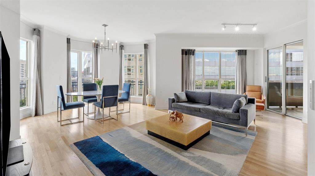 Enjoy beautiful views of Turtle Creek Park and historic Turtle Creek Boulevard from this light filled corner unit at The Mayfair.  The owner painted and updated the wood floors and kitchen cabinets for a transitional decor.  Mayfair residents enjoy a terrific location and some of the finest resident amenities in the neighborhood.  The popular Sky Club is available to enjoy downtown Dallas views and overlooks Turtle Creek Park and may be reserved for residents wishing to reserve for entertaining family and friends.  The Mayfair Room features views of Northwest Dallas.  The Third Floor includes the popular coffee bar where neighbors enjoy coffee, juice and papers in the morning before heading for a workout in The fitness room.  The beautifully landscaped garden terrace includes the pool, hot tub and grills for resident barbecues.  Fantastic urban location with easy access to The Katy Trail, Uptown, Downtown, UT Southwestern, Baylor, restaurants and shopping.  Every condo comes with two deeded parking spaces and storage space.