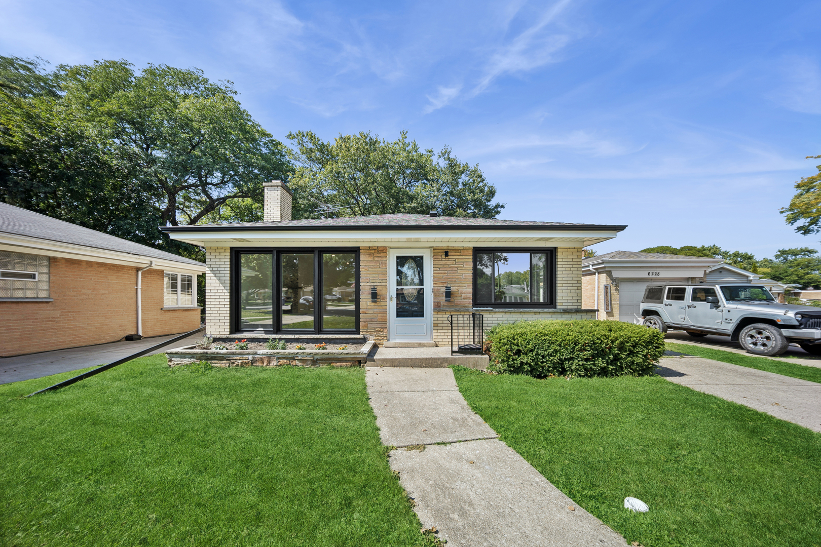 Beautifully Updated Ranch in Sauganash!!!  This move-in-ready 3-bedroom, 2-bath ranch sits on an oversized lot in Sauganash and offers a perfect blend of timeless mid-century character and modern updates.  Inside, enjoy a sun-filled living room with an intact brick fireplace, a sleek new bathroom, and a kitchen with quartz countertops, a large island, and stainless steel appliances. The fully finished basement with high ceilings is ideal for a family room, office, or gym.  The large backyard with mature trees is perfect for barbecues and gatherings. Additional features include a 1-car detached garage with driveway, new fixtures, and plenty of storage.  Close to schools, restaurants, expressways, and just minutes from Old Orchard Mall. Schedule your showing today-you'll fall in love with this home!
