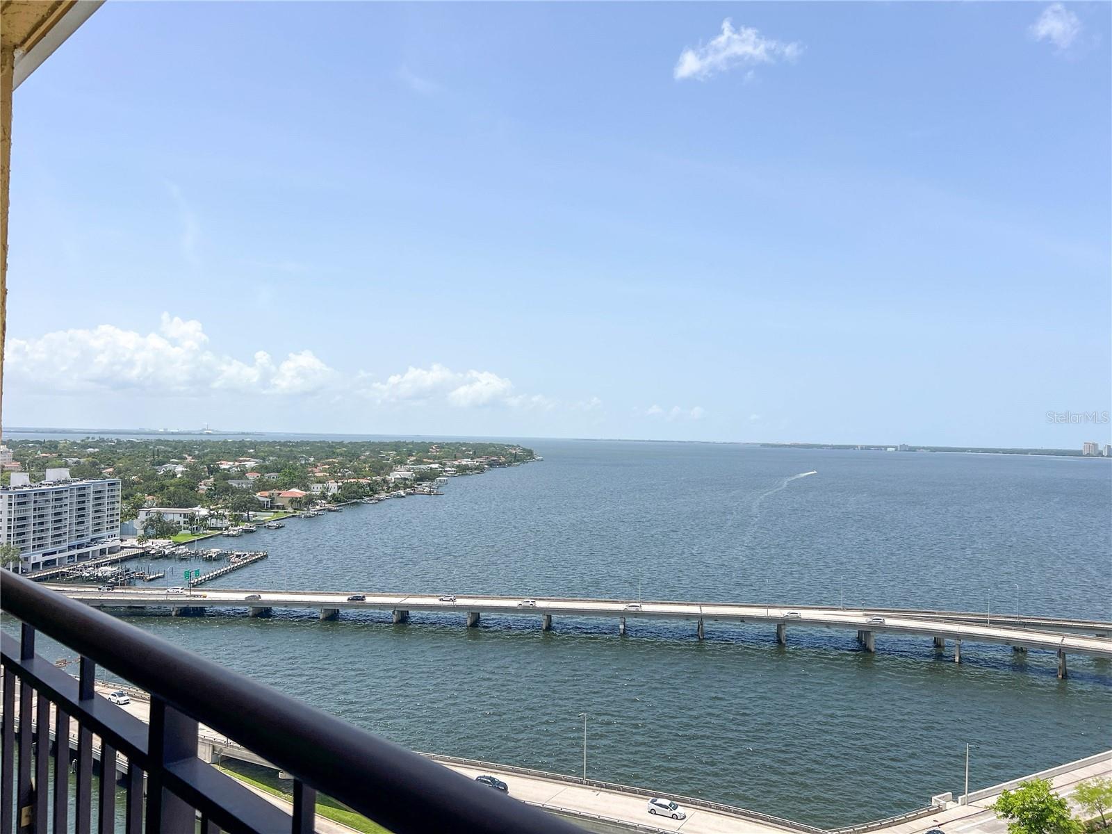 Discover the height of elegance with unparalleled luxury and breathtaking views from one of the largest units at 345 Bayshore featuring 3 bedrooms, 2 full baths and a ½ bath powder room. Dual balconies with floor to ceiling sliding glass doors and windows throughout for those astounding unobstructed water views of Tampa Bay and ever- changing sunsets. A spacious floor plan seamlessly connects the living, dining, and kitchen areas, perfect for both relaxation and entertaining, with water views from every angle and Brazilian wood flooring throughout the majority of the unit. The kitchen has been redesigned with higher end matching appliances, sleek cabinetry, pantry and
elegant granite countertops with a quaint breakfast bar catering to the culinary enthusiasts. The master suite offers its own serene escape with a private balcony, floor to ceiling sliders, crown molding, surround sound system, a custom 10’x6’ walk-in closet with built ins, and a spacious en suite bath featuring a polished travertine shower, oversized soaking tub, his/her sinks and travertine tile flooring. In both additional bedrooms you can find cozy carpeting, large closets and water views from the windows. The other full bath offers custom built in shelves, granite topped vanity and a tub/shower combo. In unit laundry room adds convenience and extra storage. Amenities at 345 Bayshore are abundant with a 24/7 front desk concierge, heated pool, spa, grill area, weight room and separate cardio center, sauna facilities, dog park, entertainment room, bike storage, car wash area, library, guest suites for visitors, storage area and personal
wine storage. Nestled in the vibrant Hyde Park neighborhood, 345 Bayshore Blvd offers immediate access to the world’s longest continuous sidewalk, perfect for morning jogs or evening strolls. Hyde Park Village, with its upscale shopping and dining options, is just moments away. Situated perfectly just outside of Downtown Tampa but close enough to Amalie Arena, Water Street, the Tampa Riverwalk, Straz Center and Davis Island. This unit has two assigned parking spaces with one being underbuilding so come enjoy the Gasparilla Parade from your private balcony!