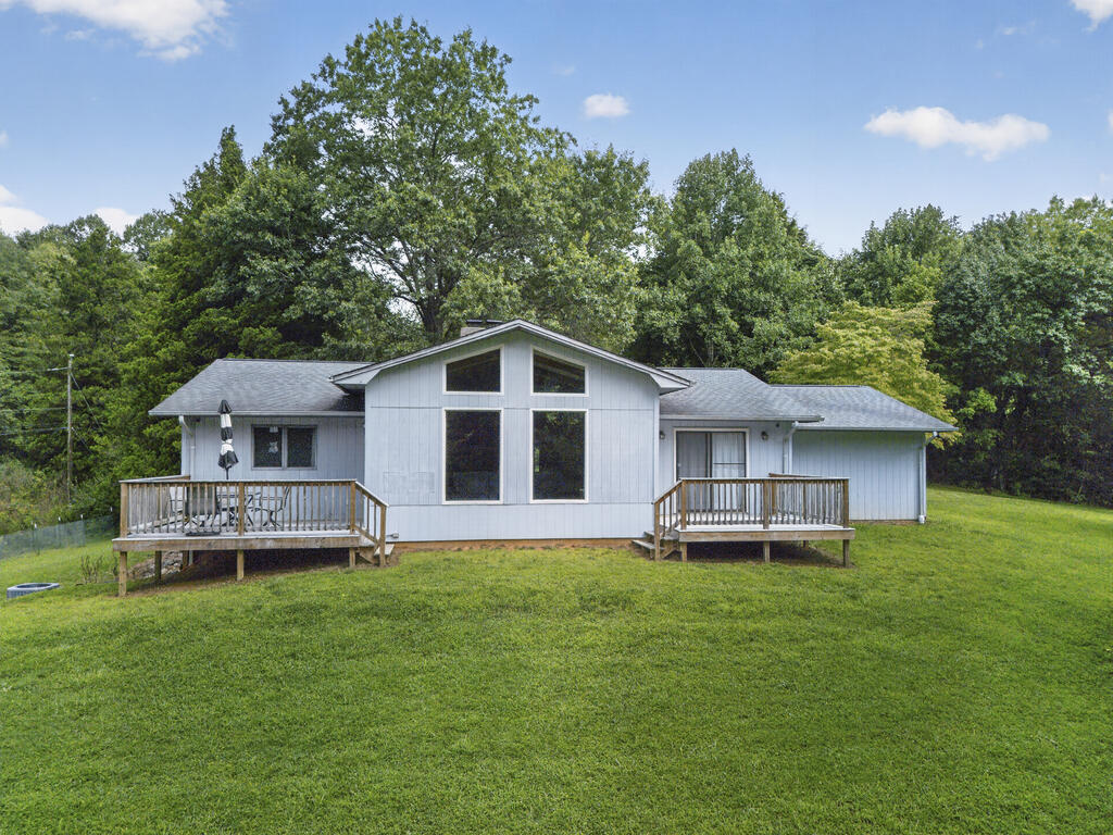 Welcome to this beautiful 4-bedroom, 3-bath home situated on 2.79 acres just outside the Town of Marion, Virginia! Offering plenty of space both inside and out, this property combines modern updates, comfortable living spaces, and peaceful surroundings. The inviting living room features vaulted ceilings and large windows that fill the space with abundant natural light, creating a bright and open atmosphere. A cozy fireplace adds warmth and character to the main level. The updated kitchen features a quartz countertop, while numerous updates throughout the home include PEX plumbing, a lifetime warranted termite treatment, and new shelving and light fixtures in the bedroom closets. The bathrooms have been thoughtfully updated with new vanities, flooring, light fixtures, plumbing fixtures, and fresh paint, providing a clean and modern feel throughout. The finished walkout basement adds valuable living space and includes a bedroom, bathroom, bonus room, and wood-burning stove ideal for guests, home office, or a separate living area. Additional features include a heated sunroom with new screens, a single-car garage with a storage room, a walkout deck from the primary bedroom, and another walkout deck from the living room. With 2.79 acres to enjoy, there is plenty of room for outdoor activities, gardening, entertaining, or simply taking in the surrounding nature. Conveniently located just outside Marion, this property offers the best of both worlds; peaceful acreage and a beautiful natural setting while remaining close to town and everyday amenities. With its spacious layout, extensive updates, and abundant natural light, this home is ready to welcome its next owners.
