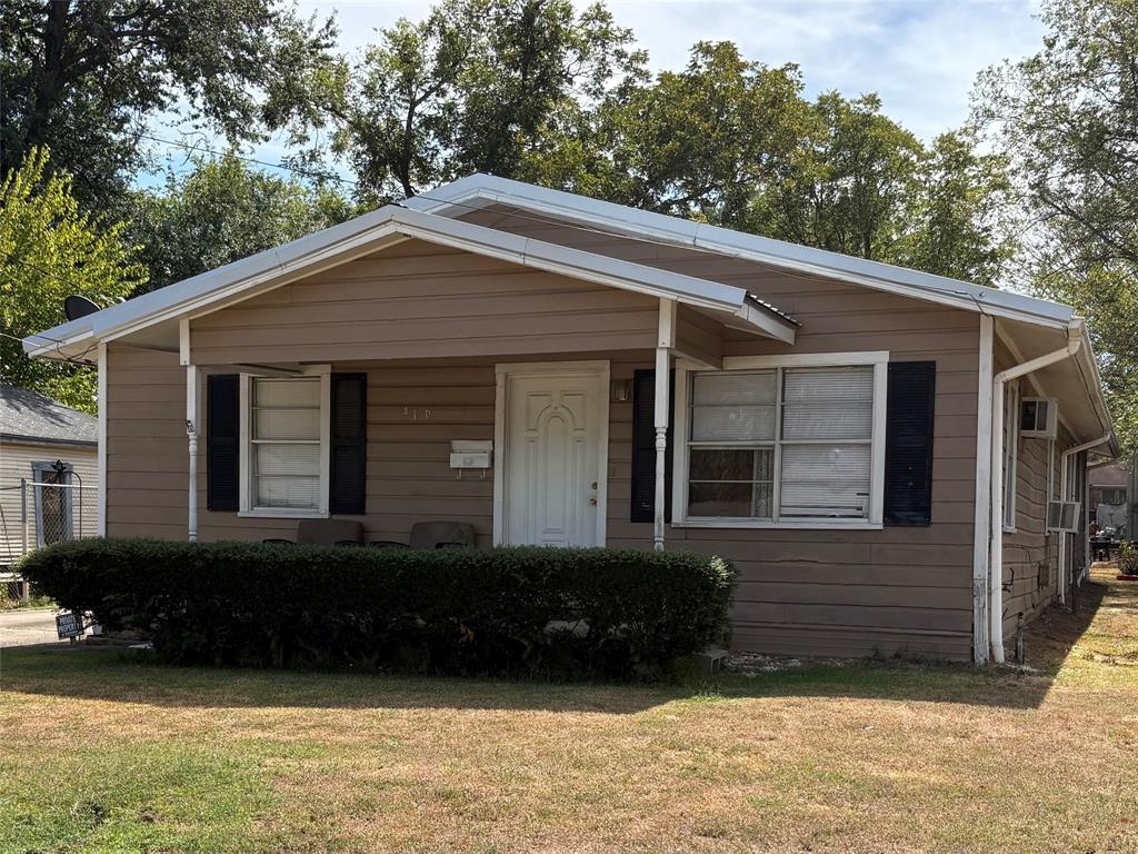 Plenty of parking with a concrete drive with 2 covered carport spaces and the large rooms highlight this traditional 3 Bedroom 2 Bath family home. Enter into a large family room and stroll down the hall past the 3 spacious bedrooms to an open type dining kitchen area that allows for plenty of entertainment space. The utility room offers room for full size washer and dryer and some storage. A bonus room that would make a great pantry or extra storage accessible from utility room. The metal room and chainlink fence creete great curb appeal. There is also a large covered area near the back door that provides a great outside sitting area and a place for your plants and other stuff. Across the partially shaded backyard there are 2 storage buildings for additional storage. Located near downtown Sulphur Springs and close enough to the park for recreational activities and additional things to enjoy.