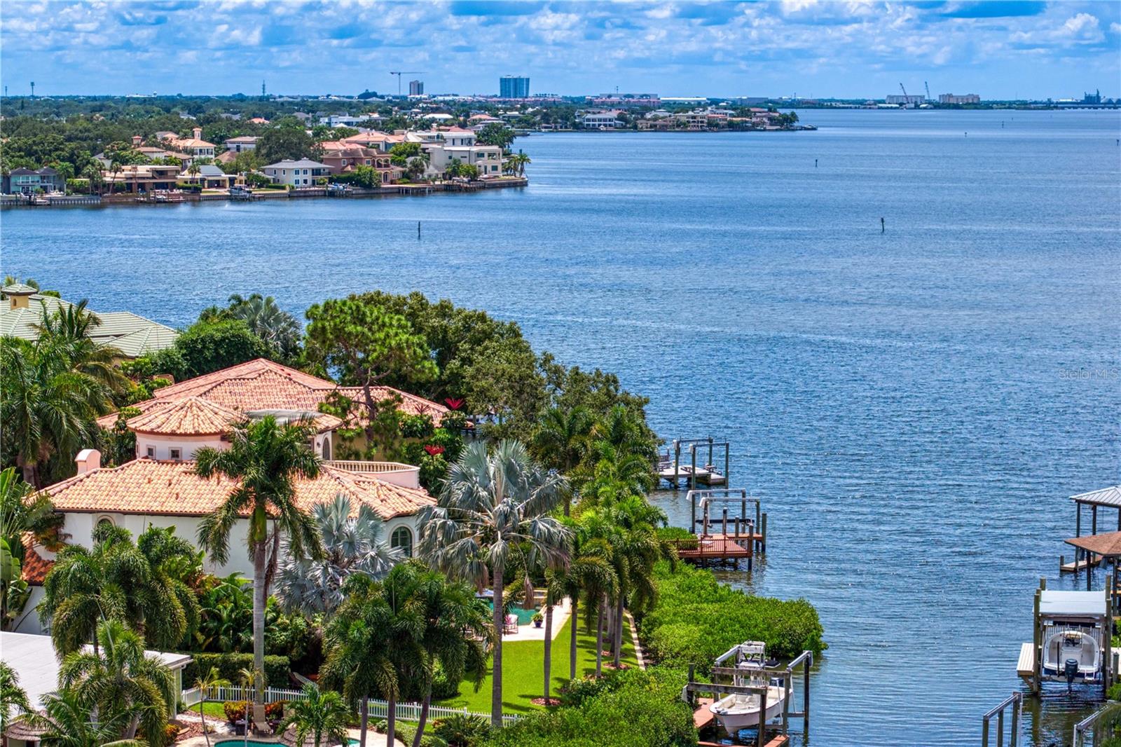 Located in the sought-after Beach Park neighborhood of South Tampa, this exceptional waterfront residence offers a rare blend of refined design and sweeping open-water views across Tampa Bay to St. Petersburg. Custom built and designed by Thomas Everett Lamb; the home embodies timeless elegance while embracing a sophisticated coastal lifestyle.Thoughtfully designed for privacy and comfort, each bedroom functions as a private suite with well-appointed bathrooms, ideal for both everyday living and hosting guests. The primary suite serves as a serene retreat, highlighted by tranquil water views and an atmosphere of quiet luxury.Throughout the home, meticulous craftsmanship and custom finishes underscore the integrity of the design. Expansive windows and intentional sightlines capture panoramic bay views while filling the interiors with natural light. The main living areas flow seamlessly, creating an inviting environment for relaxed living and elegant entertaining. Whether hosting intimate gatherings or larger celebrations, the layout balances beauty and functionality with ease.Designed to embrace its waterfront setting, the home offers an exceptional indoor-outdoor lifestyle. Enjoy peaceful mornings overlooking the bay, watch boats glide by throughout the day, and experience stunning sunsets stretching toward St. Petersburg. Direct access to Tampa Bay provides endless opportunities for boating and water activities, perfectly complementing Florida’s coastal way of life.This is a rare opportunity to own a custom waterfront residence where timeless design, premier location, and breathtaking views come together.