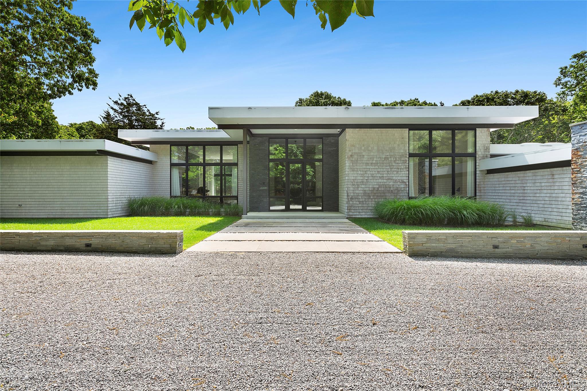 This custom-build modern radiance inspired by the original home where renowned abstract expressionist critic Harold Rosenberg once resided leaves nothing to the imagination. Situated on 5 acres in the Historic district of Springs and surrounded by 165 acre of reserve provides you with plenty of privacy for you and your family's needs. The property projects a unique history of many famous visitors such as abstract expressionist painters DeKooning, Pollock and more. The house offers 5 bedrooms all en-suite, with top-of-the-line bathrooms and double shower stalls in the master. A finished lower level featuring an exquisite spa area along with wine cellar, media lounge and private guest quarters. The expansive backyard consist of the 20x40 gunite heated pool with hot tub, an outdoor BBQ and oversized fire-pit. Equidistant from Amagansett and East Hampton village, minutes to the Ocean, Accabonac Harbor, and a variety of country markets. The location, history and luxury of this home makes it one of the most compelling properties in East Hampton. Room for tennis and horse stables.
