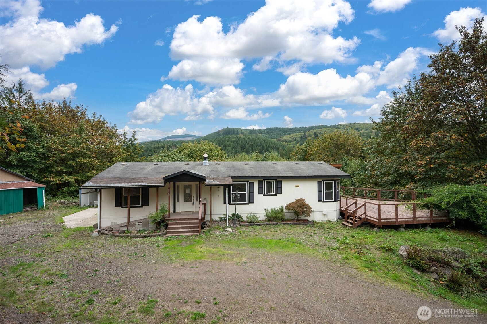 Welcome home to your private country retreat, perched high above it all and a beautiful drive from the hustle and bustle. This turnkey, one story home offers easy, low-maintenance living with a bright interior and thoughtful updates throughout. Equestrians will love the large barn with stalls, a dedicated tack room, and a private indoor arena for riding. The property also includes RV hookups and plenty of space for parking, toys, or guests. Enjoy the peace, privacy, and space of a true escape from it all.