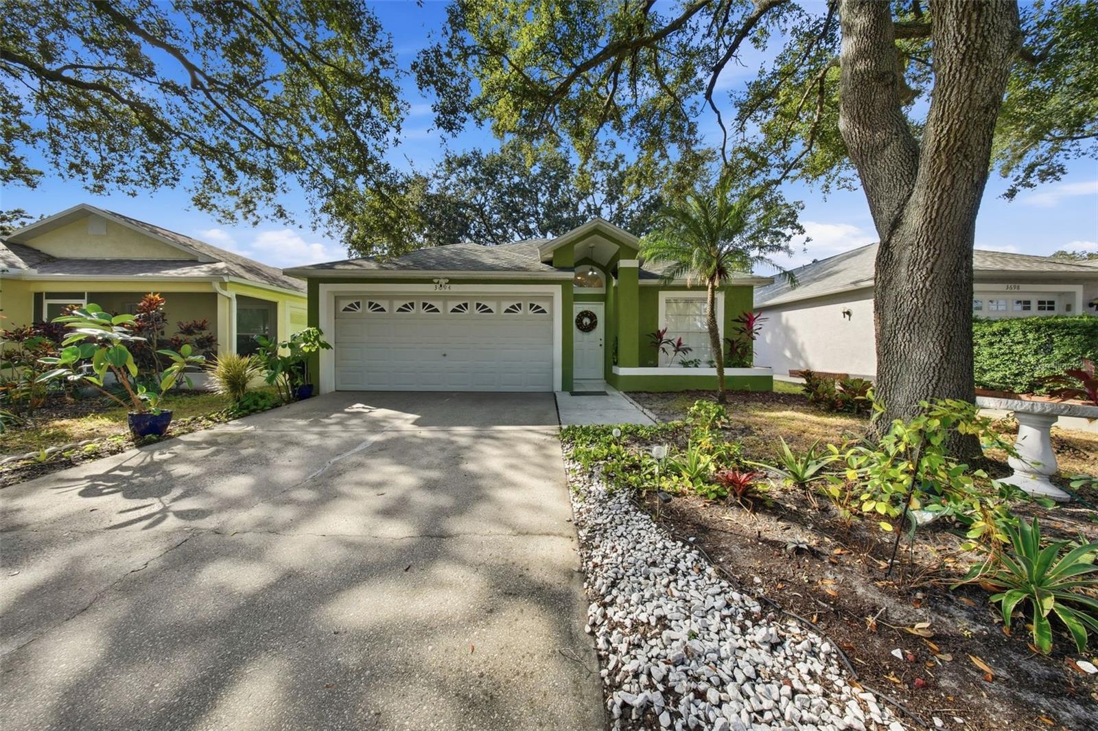 Welcome to the heart of Palm Harbor. This well-maintained residence blends style and comfort, offering a thoughtful mix of updates throughout. The home features beautifully refinished hardwood floors, newer porcelain tile, and fresh interior paint completed within the last three years. Both bathrooms have been fully renovated, showcasing modern finishes and contemporary design.With 3 bedrooms and 2 bathrooms, the layout feels spacious and inviting, enhanced by high ceilings in the living and dining areas. The kitchen offers a functional footprint and presents an excellent opportunity for personalization or a future remodel to suit your taste. Major systems have been taken care of, including a 2017 roof, approximately 8-year-old A/C, and a 5-year-old water heater, providing peace of mind for years to come.Relax in the screened lanai with a private jacuzzi, or enjoy the nearby community pool just a short stroll away. Located in the desirable Countryside area, this property offers convenient access to the Pinellas Trail, local amenities, parks, shopping, dining, and Gulf beaches.A mHomes with this level of care and upgrades are rare—schedule your visit today.