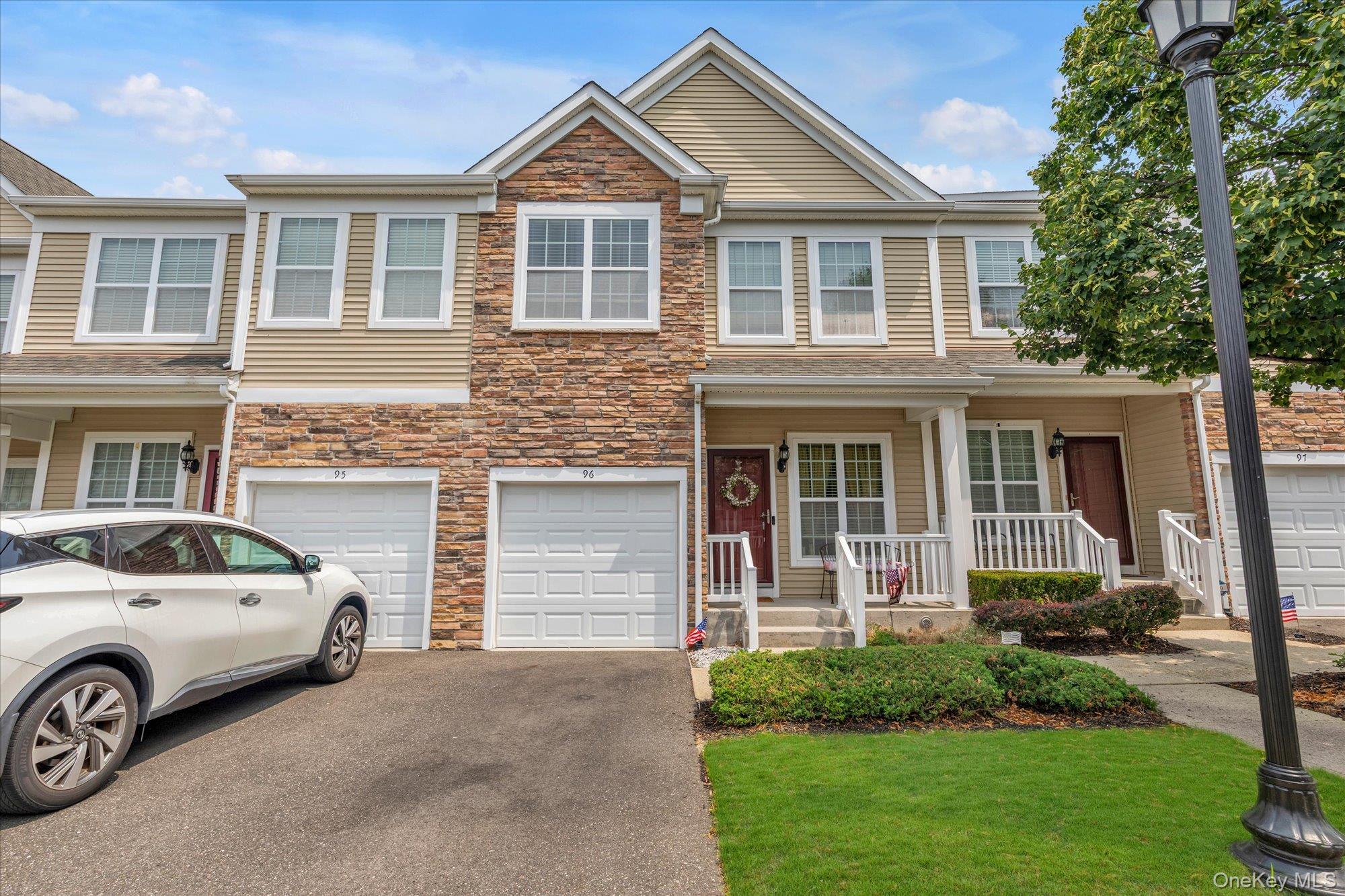 Pristine 3 Bedroom, 2.5 Bath Townhouse in the Seasons Community in Massapequa. The Main Level is an Open Concept with Dining Room, Kitchen W/ Granite and Stainless Steel Appliances and  a Large Living Room with Sliders to a Deck Overlooking a Serene Yard. There are Beautiful Hardwood Floors, Custom Moldings and a Convenient half Bath. The Primary Bedroom has a Full Bath and Walk-in Closet. Laundry is situated on the Second Floor in the Hallway. Besides a Full Basement, CAC and an Attached Garage, a Lovely Front Porch is your entrance. Come and Enjoy all this Community has to Offer including: Pool, Fitness Center, Club House and Playground