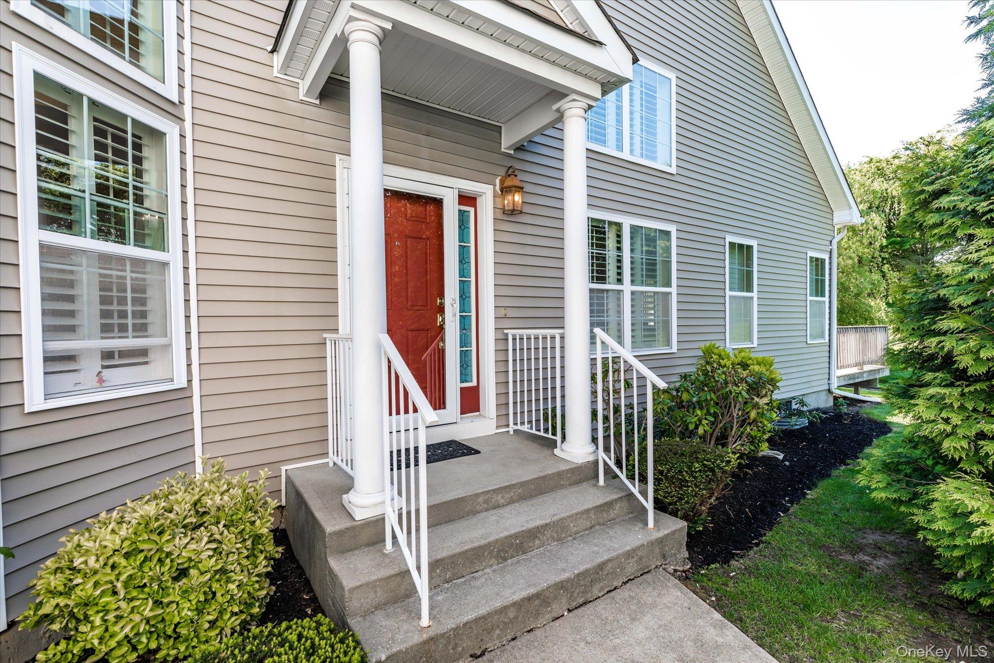 This charming Garden Apartment at The Vineyards at Miller Place offers 2 bedrooms, 2.5 bathrooms, and an open-concept first floor with high ceilings, recessed lighting, and wood shutters throughout. The eat-in kitchen has tile floors and an alcove, while the spacious master suite includes an en suite bathroom and walk-in closet. The second floor features Berber rugs, a second bedroom, and a loft area overlooking the living/dining room. A finished basement with ample storage and a 1-car attached garage complete the home. Gated Community amenities include a clubhouse with a kitchen, fitness room, heated swimming pool, tennis and bocce courts, and a private trail through 14 acres of landscaped grounds. Residents can also enjoy yoga classes, billiards, and a gazebo with a community garden.