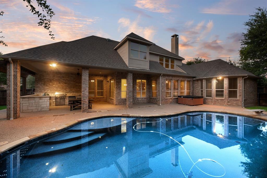 Available for Sale or Lease! Welcome to a home where luxury, comfort, and thoughtful design come together effortlessly. This exceptional floor plan offers everything today's buyers are looking for with the spacious primary suite, private guest suite, dedicated study, and media room all conveniently located on the main level. Upstairs features two additional bedrooms, an oversized game room, and an expansive flex space ideal as a fitness studio, hobby or craft room, playroom, or easily converted into a fifth bedroom. Rich hardwood flooring, designer finishes, and abundant natural light complement the gourmet kitchen featuring a built-in Sub-Zero refrigerator, gas cooktop, pot filler, generous prep space, and an oversized utility room with sink and room for an additional freezer. The separate third-car garage bay offers the perfect workshop, golf cart storage, or additional space for hobbies. The inviting family room overlooks a resort-inspired backyard complete with a lagoon-style diving pool, tanning ledge, tranquil water feature, and an incredible outdoor living area featuring a covered patio, built-in grill, Big Green Egg, refrigerator, serving bar, and plenty of space for entertaining. A grassy side yard provides additional room for pets or play, while the home's prime location directly across from a neighborhood park offers beautiful views and extra green space. This is the perfect blend of luxury living and everyday functionality. Also Available for LEASE 6 MONTH TERM $5,800