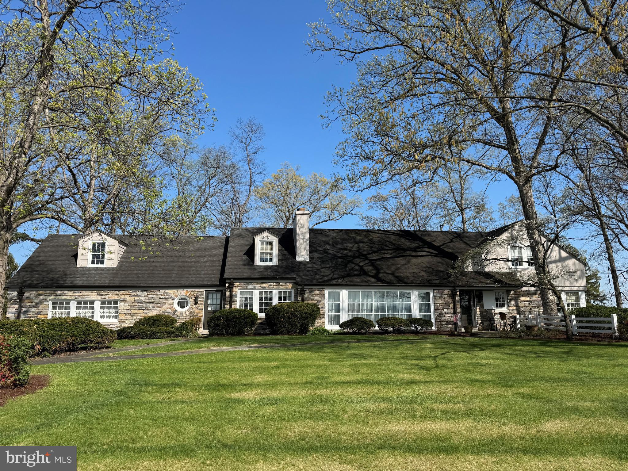 Nestled just west of historic Gettysburg in the desirable Longview Estates community, 30 Longview Drive, offers a rare opportunity to own a truly iconic stone residence rich in character, craftsmanship, and timeless appeal.This 4100 sq ft spacious residence offers 4 bedrooms and 3.5 baths, including a convenient first-floor primary suite, perfect for most family situations. The main level features a 29ft x 25ft expansive living room with wood-burning fireplace ideal for entertaining guests. Both the kitchen and lower level are equipped with wet bars, adding versatility and charm for hosting gatherings.Start your mornings in tranquility on the generous 33’ x 12’ screened-in porch, which faces east and provides a peaceful setting to enjoy the sunrise.Natural light pours into the home through a stunning 6’ x 20’ bay window, perfectly framing breathtaking sunset views. Built in the 1950s by Lieutenant General Willard Paul (who served with General Eisenhower) and Luella Musselman, this distinguished home was constructed to stand the test of time. It features authentic stone construction—not veneer—paired with solid concrete design. Three fireplaces and radiant heated floors ensure warmth and comfort throughout the cold Pennsylvania winters. A supplemental heat pump provides efficient, on-demand heating during the transitional seasons of spring and fall.This 1.43-acre property with gardens is further enhanced by a circular driveway, a two-car garage, and ample additional parking.This is more than just a home; it’s a piece of local history, combining classic elegance, thoughtful design, and enduring quality in one of Gettysburg’s most prestigious settings.**Professional photos coming
