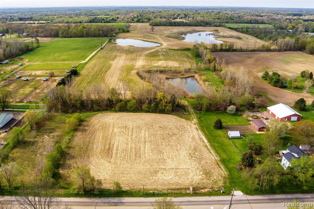 Two spectacular parcels are being sold together for a combined contiguous 103.97 acres of prime Richfield Twp. land with dual frontage on E. Richfield Rd. and Potter Rd., and offer possible development (was once approved for residential housing development), farming/agricultural/hunting or for single family home construction. Extensive paved frontage allows for easy ingress and egress to this unique property. This property is an outdoor enthusiast’s dream with open farmland, 3 ponds, and a stand of woodland providing habitat for deer, turkey, fowl and small game in abundance. Building site(s) allow for possible daylight/walkout basement construction. Electric, sanitary sewer and natural gas utilities are available at the road. Private well required for water source. Address is for mapping purposes only and needs to be assigned by Twp. Property can be accessed on Richfield Rd. (between 8206 and 8282 Richfield Rd.) or on Potter Rd. (between 8155 and 8177 Potter Rd.)
