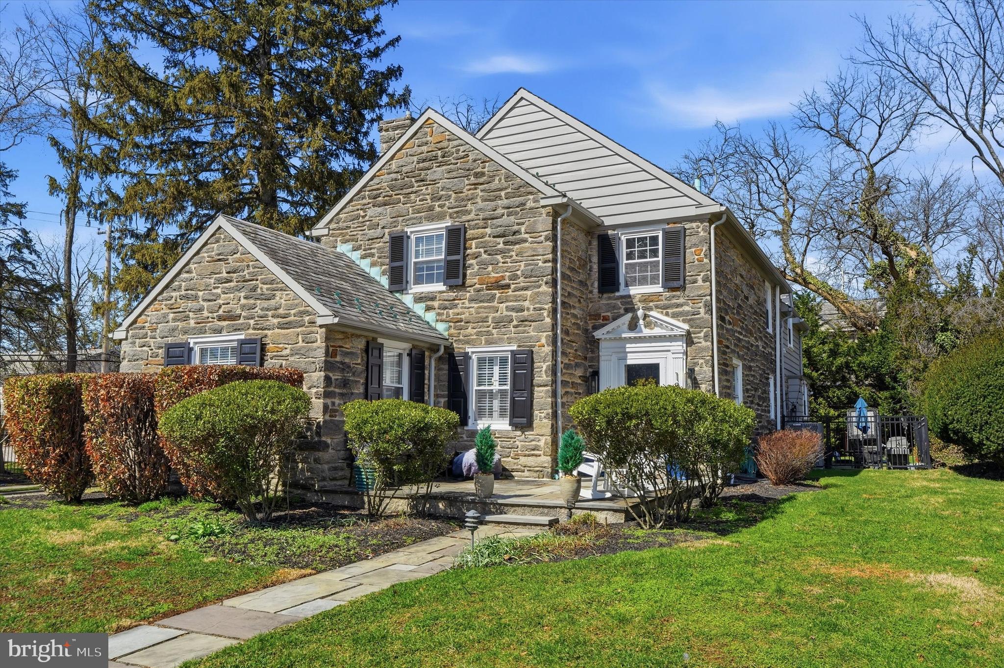 Welcome to this elegant stone residence offering a thoughtfully designed floor plan, generously sized rooms, and a highly convenient location. Lovingly maintained and significantly improved over the past two years, this home blends classic character with modern comfort. Recent upgrades include a beautifully updated eat-in kitchen featuring granite countertops, rich cherry cabinetry, stainless steel appliances, and a charming wet bar with a stained-glass cabinet. Throughout the home you will find refinished hardwood floors, new windows with custom window treatments, and freshly painted rooms with updated baseboards, creating a bright and polished interior. The spacious living room is anchored by a slate gas fireplace, while the cozy den or office provides the perfect retreat for work or relaxation. A very large dining room with a lovely bay window offers an inviting space for gatherings and entertaining. Upstairs are three spacious bedrooms, each with generous closets. The primary suite features its own gas fireplace and a brand-new private bathroom. The second floor also offers the convenience of a laundry area and a beautifully renovated hallway bathroom. The fully finished lower level adds exceptional flexibility with two additional rooms—ideal for a playroom, gym, guest space, or office. Completing the home is a two-car attached garage and a layout that offers comfort, functionality, and timeless appeal.