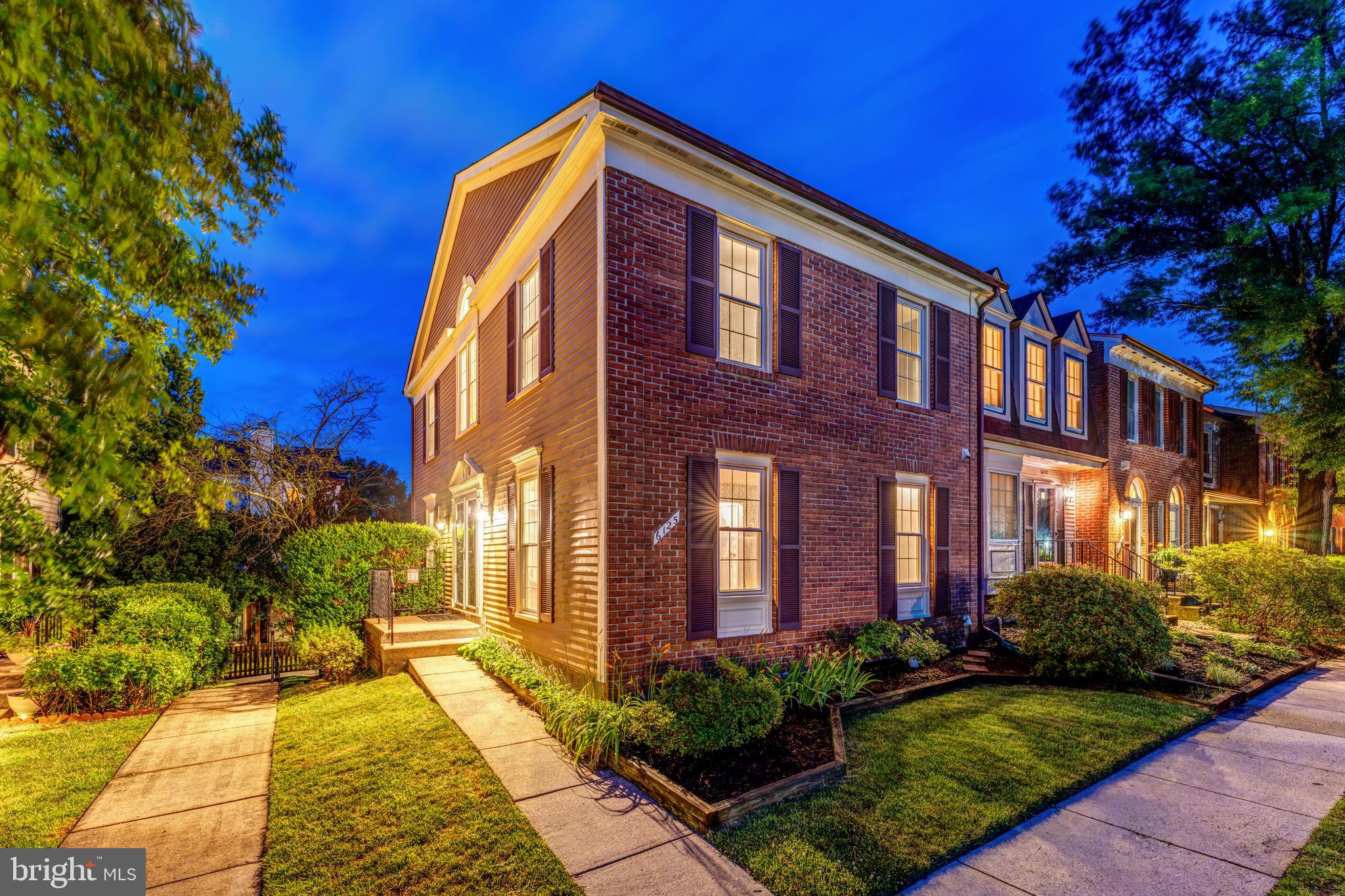 From the moment you pull up, this end-unit brick townhome feels different. Tucked back in Wellington Commons, it's one of the largest homes in the neighborhood with more than 2,500 finished square feet, a two-level bump-out, dedicated parking right out front, and beautifully maintained curb appeal throughout the community. Being on the end means it lives much more like a single-family home, and the backyard is one of those spaces you'll actually use. It's fully fenced, backs to trees and common space instead of another row of homes, and has two full-length decks that stretch across the back of the house. The upper deck connects directly to the kitchen through a three-panel French door, making it easy to carry dinner outside or host friends, while the lower deck has built-in benches and creates another place to relax. Inside, the hardwood floors run throughout the main level, upstairs, and even the staircase, while windows on three sides bring in natural light all day long. The family room is incredibly large and gives you plenty of flexibility whether you love oversized furniture, need room for a crowd on game day, or just want a space that never feels cramped. The dining room sits right off the kitchen, making holidays and everyday meals equally convenient. The kitchen itself offers plenty of cabinet and counter space with granite countertops, stainless steel appliances that have all been replaced within the last five years, and a breakfast area that's big enough for a full table instead of just squeezing in a couple of stools. Upstairs, the primary suite feels more like a retreat than just a bedroom. The vaulted ceiling adds to the sense of space, there's easily enough room for a king bed plus a sitting area or home office, and the two walk-in closets mean nobody has to fight over storage. The en suite bath has already been updated with a beautiful glass shower, dual sink vanity, and a soaking tub that's actually big enough to enjoy. Two more generously sized bedrooms share the second full bath, which gives you the opportunity to update it exactly the way you want over time. Downstairs, the walkout lower level almost feels like its own living space. New luxury vinyl plank flooring, recessed lighting, and a three-panel French door make it bright and inviting. The rec room centers around a cozy gas fireplace and an incredible bar area finished with white shaker cabinets, premium quartz countertops, and a coordinating backsplash. Whether you picture hosting football Sundays, movie nights, or creating the ultimate hangout, this space is ready for it. There's also a beautifully remodeled full bath with stylish tile, a seamless glass shower, and an upgraded vanity, along with a large den that works equally well as a home office, gym, guest room, or hobby space. If you've been looking for a home with income potential, the entire lower level could easily function as a private living area. Storage won't be an issue either, with multiple closets and extra storage space throughout the lower level. Beyond the cosmetic updates, many of the important systems have already been taken care of, including a roof and furnace that are both just two years old, along with copper plumbing, gas heat, and gas hot water. The HOA is a reasonable $92 per month, and the neighborhood offers walking paths, a pond, gazebo, and playground just steps from your front door. You're also only minutes from Kingstowne Towne Center, Springfield Town Center, Old Town Alexandria, parks, trails, the Franconia-Springfield Metro, and major routes including I-395 and I-495, putting Old Town about 15 minutes away and Washington, D.C. in roughly 20. It's the kind of home that gives you room to spread out, plenty of privacy, and a location that makes everyday life easy.