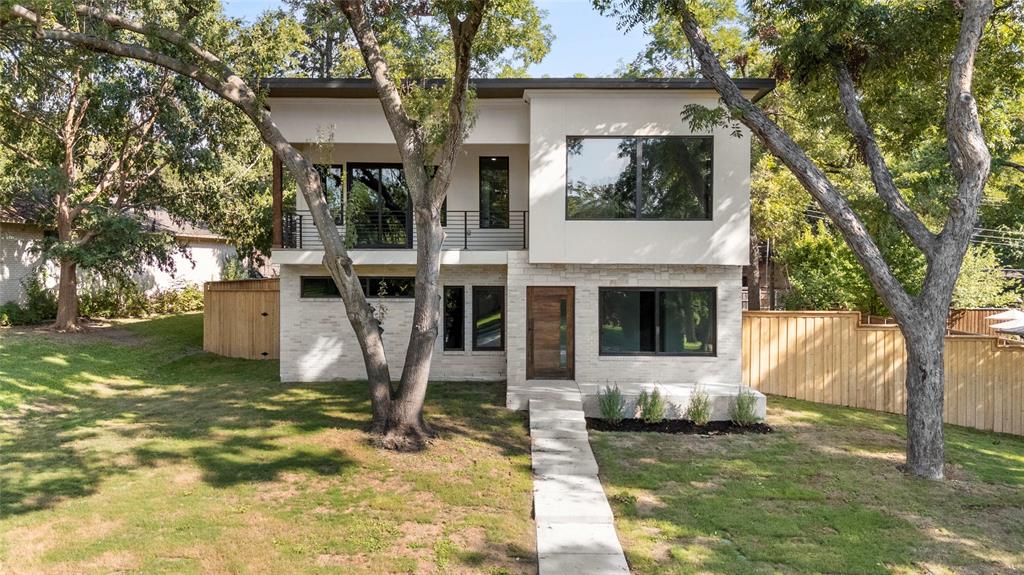 Perched on one of the most picturesque tree-lined streets in Eastwood Estates, this home combines the convenience and efficiency of new construction with the charm and character of a well-established East Dallas neighborhood. The open floor plan is ideal for entertaining, with expansive windows that blur the lines between indoors and out. The spacious primary suite includes a private balcony, while the spa-like bathroom provides a true retreat for even the most discerning buyer. Outside, the generous backyard offers ample space for a pool while still leaving plenty of green space for kids or pets. This rare blend of modern amenities and neighborhood charm is a hard find in today’s market—don’t miss it!