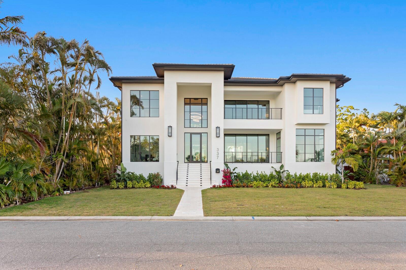 Luxury, Waterfront Single Family Home Located on the Highly Coveted Coffee Pot Drive NE with Beautiful Views of Downtown St Petersburg! Constructed by One of Tampa Bay's Premier Home Builders, Hughes Construction, this Contemporary Home is Overflowing with Top-of-the-Line Finishes and Design Style. Boasting 6,290 Total Living SF, this Two-Story, All Block Construction Residence Offers Four (4) Bedrooms + Office + Bonus Room (which can be used as 5th bedroom), Five and One-Half Bathrooms (5.5), Loft Area, Oversized Two (2) Car Attached Garage and a Heated Pool with Raised Spa. Resting on a Large Lot (90' x 127') with Boat Dock Across the Street, this Florida Lifestyle Home Includes an Expansive Front Porch & Owner's Balcony, and Additional Deck & Spacious Lanai Area off the Back with Serene Setting Overlooking the Pool & Coconut Palm Trees. Natural Light Pours in From All Angles through the Large Amount of Impact Rated Glass Windows & Doors, and the High Ceilings (11'4" on Main & Second Level in Select Rooms, and Vaulted Owners Suite & Bonus Room) with Open Floor Plan Make the Home Feel Light & Airy. A Chef's Kitchen with Subzero & Wolf Appliances, Luxury Line Cabinetry & Countertops, and Expansive Walk-In Pantry is an Entertainer's Dream. The Owner's Suite is Perfectly Positioned to Capture the Most Amazing Water Views and Views of the Downtown St Pete Skyline, and Includes a Grand Master Bathroom, Master Closet with Custom Organization Systems, Sprawling Bedroom Space with Wet Bar Area and Private Deck. Additional Features Include an Elevator, Concrete Tile Roof, Whole House Generator, Reverse Osmosis Water Filatration System, Electric Fireplace, New Dock & Lift, Luxury Plumbing & Electrical Fixtures, Outdoor Kitchen Area, Custom Metal Railings, Level 5 Finish Drywall, Solid Core Interior Doors and So Much More. Located within Steps to Coffee Pot Park & Boatramp, and Minutes to Booming Downtown St. Petersburg; This Home is Perfect for the Discerning Waterfront Buyer Seeking the Social Lifestyle of Coffee Pot Bayou.  **Please note, the included photos were taken prior to listing and when the home was staged.  The home does not currently have the pictured furniture inside.**