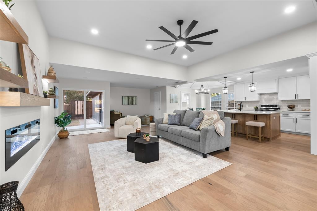 Experience a stunning luxury transformation in this beautifully renovated classic Plano home. This one-story residence offers 2,205 sq. ft. of modern living with 3 bedrooms, a dedicated office and 2.5 baths, located in the heart of West Plano. Step inside to discover all-new high-end finishes throughout, including engineered hardwood floors and a chef’s kitchen featuring a large white oak island, quartz countertops, custom-built cabinetry, stainless steel appliances, a gas cooktop with vent hood, and a convenient pantry. The open-concept living area showcases a sleek electric fireplace and stylish modern design. Enjoy multiple dining options with a formal dining room, breakfast area, and island seating. A versatile flex space provides room for a second family area or playroom. The primary suite is a true retreat with a spa-like bath, including a freestanding soaking tub, walk-in shower, dual vanity, and a large walk-in closet. The home office can be used as a forth bedroom. Enjoy the pool-sized backyard, fully fenced with a rear-entry two-car garage. Additional highlights include a separate laundry room, no HOA, Plano ISD schools, and proximity to shopping, dining, parks, and the neighborhood elementary school. Recent updates also include-Cast iron plumbing replaced and a new roof.