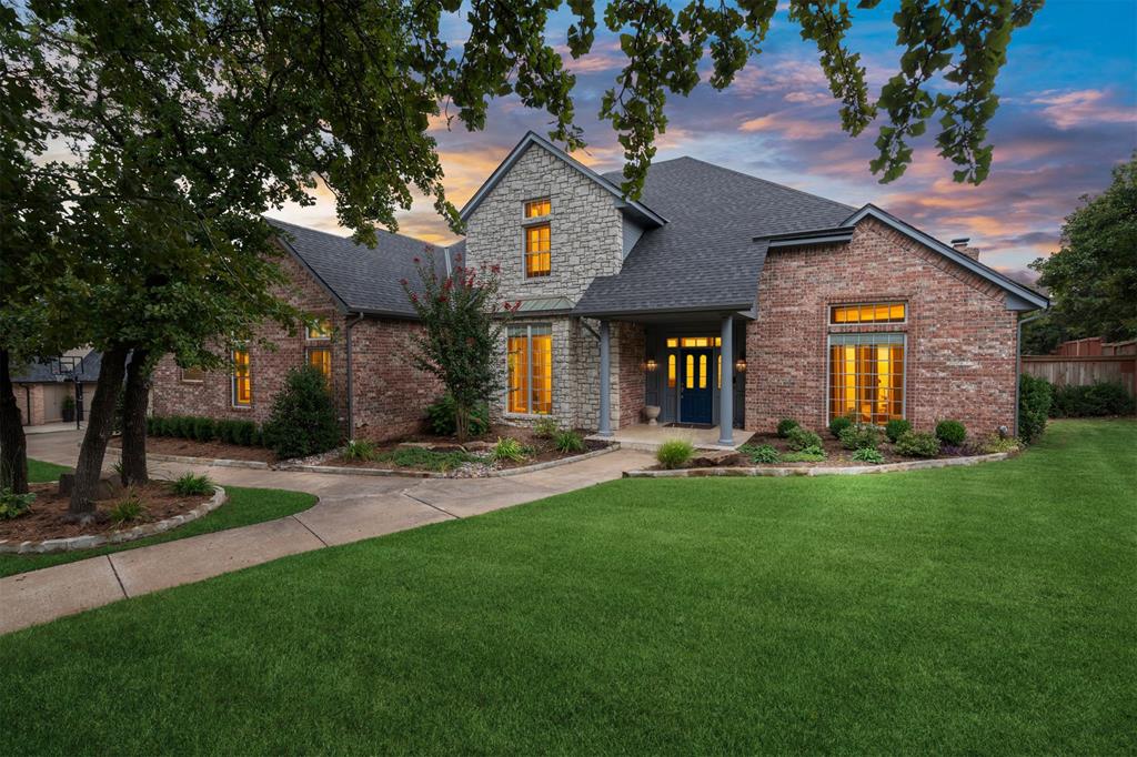 Located in Hunters Creek, one of Edmond’s most desirable tree-lined neighborhoods within Edmond North Schools, this expansive home is designed for both everyday comfort and grand entertaining. Step into the dramatic entryway with soaring ceilings, a sweeping staircase, and rich wood floors that flow into the large formal dining. The formal living impresses with tall ceilings, while the spacious family room offers a cozy fireplace, custom built-ins, and wall of windows overlooking the backyard. The open kitchen is a chef’s delight with island, breakfast bar, abundant cabinetry, double ovens, built-in microwave, cooktop, and adjoining dining space. Downstairs also features a huge private study with built-ins, along with an oversized primary suite with spa-like bath including jetted tub, walk-in shower, and a massive closet. Upstairs is a true retreat with a vaulted game/media room, one en suite bedroom, plus two additional bedrooms with a Jack & Jill bath—each with its own walk-in closet. A large laundry room with sink and built-ins adds extra function and convenience. Just wait until you step outdoors and see this amazing half-acre yard. The manicured lawn and mature trees provide plenty of space to relax or play. The expansive pool with adjoining jetted spa features a diving board and dramatic waterfall, creating both beauty and sound for a resort feel. A covered patio completes the space, perfect for entertaining or quiet evenings at home. Recent updates include full interior and exterior paint, upstairs carpet, brand-new roof with gutters, tankless hot water tank, new garage door openers, updated pool robotics, Eufy security system and the list goes on.  This home has been exceptionally well cared for, and it shows. Prime location near Oak Tree National and Mitch Park. A rare opportunity in Hunters Creek to enjoy expansive living with a pool and plenty of room for entertaining~don’t miss it!