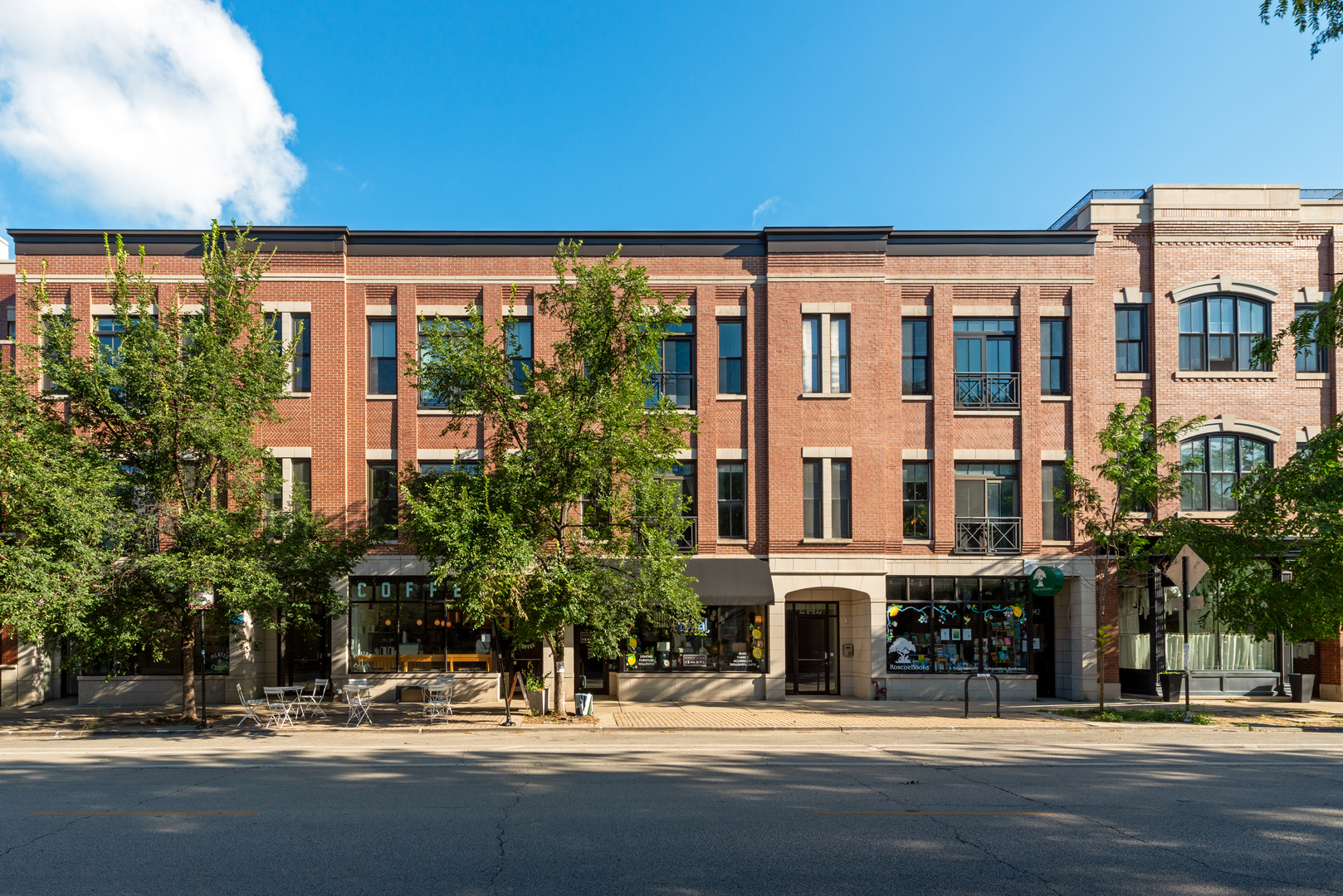Located in the heart of Roscoe Village within the coveted Level 1+ Audubon School District, this spacious 3Bd/2.5Ba home in an elevator building offers the perfect blend of style and convenience. The open-concept living and dining room features soaring 10' ceilings, 8' doors, a gas starter fireplace, hardwood floors throughout, floor to-ceiling windows, and a Juliet balcony that fills the home with natural light. The airy primary suite includes a large walk-in closet and a luxurious ensuite bath with dual vanity, water closet, and a full-body spray shower. Two additional generously sized bedrooms share a full bath, plus a convenient powder room and laundry closet. Enjoy coveted garage parking, a private roof deck and additional storage. Recent updates include fresh paint throughout, refinished/stained hardwood floors, new lighting and faucets, new hardware in kitchen & bathrooms, painted  cabinetry and added soft close, quartz countertops in all bathrooms, new mirrors in all bathrooms and new can lighting throughout. Move right in and enjoy modern living in one of Chicago's most vibrant neighborhoods.