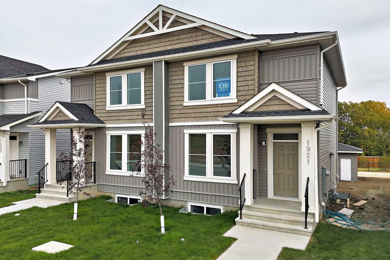 WELCOME TO IRON LANDING IN CROSSFIELD - A fast growing family friendly community ! This beautiful 2-Storey Half Duplex offers everything your family needs, with 3 bedrooms upstairs, A fully finished basement with separate side entrance, bedroom and bathroom - perfect for guest, in-laws, or other purposes. A double detached garage for parking and storage. Enjoy the convenience of being just steps away from walk paths to veterans park across the street, Schools, baseball diamond, soccer fields, playgrounds, rec center and splash water park for the kids.  You'll love the nearby restaurants, bakery and other local amenities that makes daily living a breeze. Just 10 minutes drive to Airdrie Superstore and other amenities. This home is perfect for families looking for comfort, space and community living. COME CHECK IT OUT