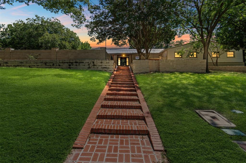 Epic opportunity for tennis, pickleball and golf lovers! Prominently situated on the 10th fairway of Ridglea Country Club’s golf course. This 4 bedroom, 3.5 bathroom contemporary yet transitional home comes with a pool and tennis court. Nearly one acre lot. Brick entry walkway and Austin stone exterior welcomes you. Once inside, you will be wowed with the spacious rooms, offering 5 inch white oak hardwoods throughout most of the home. Formal living and dining rooms. Impressive great room with vaulted ceiling, perfect for entertaining. 2 gas fireplaces, one in each living room. A quartz waterfall edge island anchors the custom kitchen along with 5 burner gas stovetop, double ovens, abundant cabinetry and built-ins.  Bright breakfast room with wet bar, wine fridge, Thor ice maker. Primary suite has custom California closet. Additional flex room with attached half bath, perfect for office, gym, etc. Long driveway and 2 car garage offers plenty of parking. Desired location in Ridglea, with easy access to RCC and Camp Bowie.