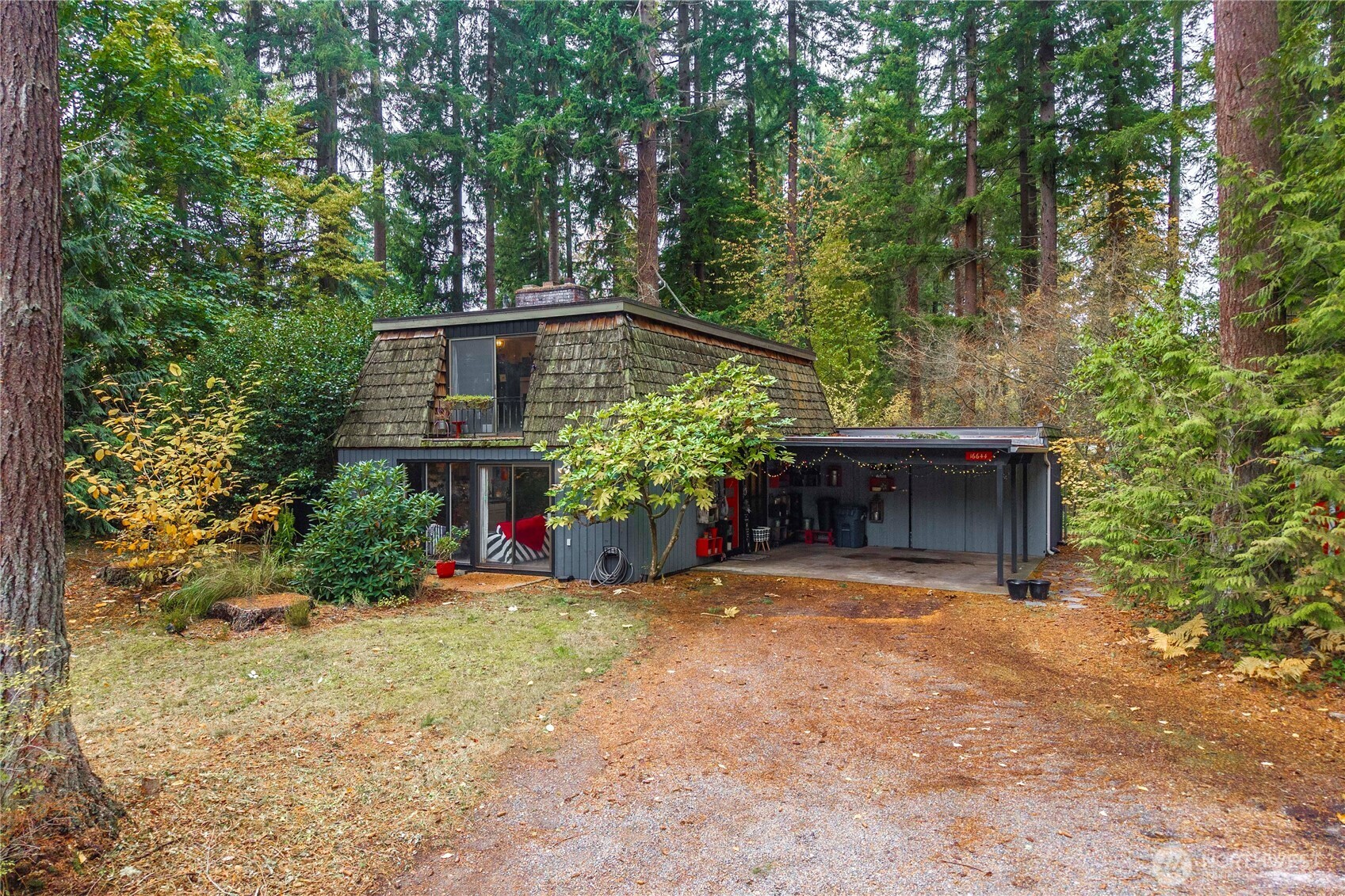 This fun and funky home is full of charm and ready for its next chapter. A true investor’s dream, this property is bursting with potential and offers endless possibilities. With a new septic system needed and some finishing touches required, it’s the perfect opportunity to bring this cutie back to dream home status. Featuring 3 bedrooms, 1.5 baths, floor-to-ceiling windows, multiple fireplaces, and an updated open-concept kitchen, the home feels bright and inviting. Expansive living spaces and open staircase add architectural interest. Nestled among the trees for true privacy, this property is ideal for a rehab loan or savvy investor looking for development or income-producing potential. Septic bid just over 34k Sold AS-IS. HUGE potential.