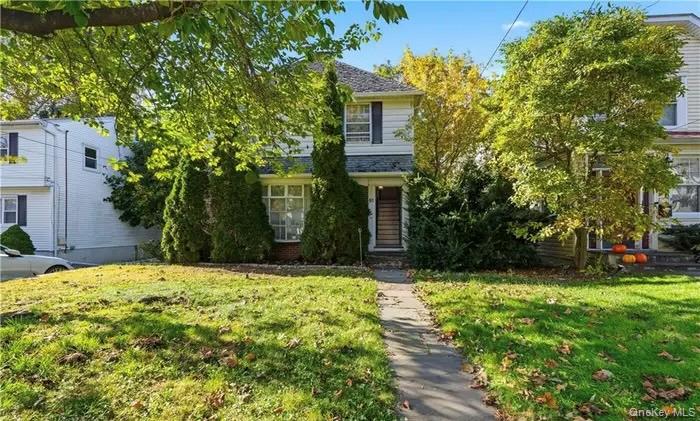 Welcome to this beautifully maintained 3-bedroom, 1.5-bath single-family home, radiating timeless 1940s charm and comfort. From the moment you step inside, you’ll notice the warm hardwood floors, inviting formal dining room, and spacious eat-in kitchen featuring a rare wood-burning grill—perfect for hosting and creating memorable meals and Deck off the kitchen.  The finished basement offers flexible space for a family room, home office, gym, or additional storage. Step out onto the deck for seamless access to the backyard, ideal for barbecues, relaxation, and seasonal entertaining. With a 4-car driveway and a garage, parking is convenient and plentiful. This home’s location is truly unbeatable. Nestled in a pristine Tuckahoe neighborhood, you’ll enjoy quick access to major parkways and multiple transportation options, including Metro-North, offering an effortless commute to Manhattan—just minutes to Grand Central. Local bus lines, nearby train stations, and easy highway connections make travel simple whether you’re heading to the city or exploring Westchester.  Enjoy the best of suburban living with vibrant restaurants, charming lively bars, and beautiful parks just moments away. Convenience, character, and location all come together in this exceptional property.