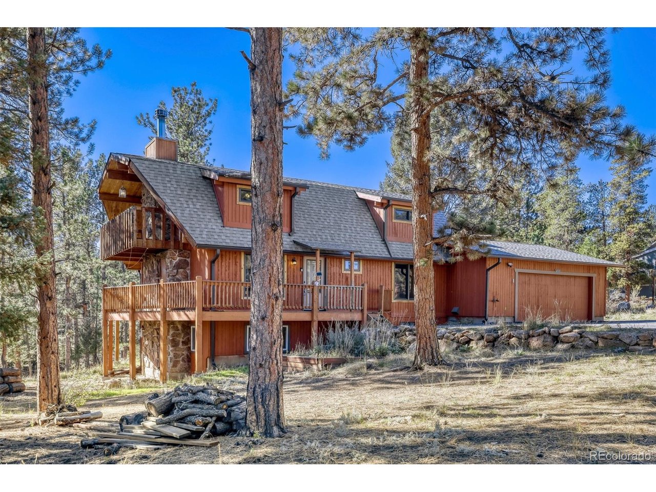 Woodside Park property is ready to welcome you home. This beautiful home on 2,586 sq. ft. home offers 4 bedrooms, 2 bathrooms, and the opportunity to enjoy a mountain lifestyle with room for horses, gardening, hobbies, and outdoor relaxation. The property is legally permitted for outside water use and allows up to 2 horses, making it an appealing opportunity for those seeking an equestrian-friendly property.Recent updates include a new roof and new carpet and kitchen floor, new interior paint while the oversized 2-car garage with compressor provides excellent space for projects, tools, and equipment. A paved driveway offers convenient access, and the fully fenced property provides defined space for enjoying the outdoors. Step onto the wraparound deck and take in the peaceful, wooded surroundings, or retreat to the private backyard for relaxing, entertaining, and enjoying Colorado's fresh mountain air. A hoof and walking path borders the back lot line, adding to the property's outdoor appeal.Garden enthusiasts will love the greenhouse and raised garden beds, offering the perfect setting to grow vegetables, herbs, and flowers. Forced-air heating with natural gas provides year-round comfort.Enjoy the balance of peaceful mountain surroundings and convenient access to nearby recreation and amenities. Located approximately 10 minutes from Staunton State Park and local amenities, 15 minutes from shopping in Conifer, and 35 minutes from the Denver metro area, this property offers an appealing combination of privacy, accessibility, and Colorado outdoor living.If you've been searching for usable acreage, legal horse property, garden space, and a comfortable Foothills home in a desirable mountain community this home is your next home!