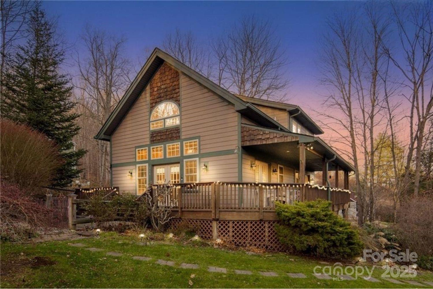 Stunning and Serene.  Wake up to Grandfather Mountain perfectly framed in your primary bedroom window—an unforgettable view that sets the tone for this inviting 3-bedroom, 2-bath home. Inside, vaulted ceilings, large windows, and abundant natural light create a bright, airy atmosphere with the warmth and charm of a classic mountain cabin. Hardwood flooring adds richness and character, with tile accents in key areas for a polished, practical touch.The kitchen flows seamlessly into the living room through an open floorplan that feels both welcoming and functional. Generous counter space, a stainless steel appliance package, and easy sightlines into the main living area make this a natural gathering spot—whether you’re cooking, entertaining, or enjoying a slow mountain morning. The bathrooms feature clean, well-kept finishes and tasteful details that offer comfort without demanding updates.Set within the desirable Grandfather Farms community, the home sits almost exactly between Boone and Banner Elk, giving you effortless access to the best of both towns. Sugar Mountain’s ski slopes are only minutes away, and Tynecastle Center is just three minutes down the road for groceries, dining, and everyday essentials. ASU events, Banner Elk’s boutique shops, and Linville’s scenic trails all sit comfortably within reach.The multi-level layout enhances privacy and flexibility. The elevated primary suite feels like its own retreat, complete with peaceful morning light and long-range views. The fully finished, heated-and-cooled basement adds versatility—great for an extra sleeping area, home office, gym, studio, or den.Outside, the expansive side porch invites you to unwind in the crisp mountain air, whether you're sipping coffee or hosting friends at sunset. The attached garage is a rare High Country convenience, especially during snowy months.To make transitioning effortless, the hot tub and most furnishings can convey with the sale—allowing you to settle in and enjoy the space right away.Whether you're seeking a scenic getaway or a comfortable full-time residence, this home blends iconic views, flexible living spaces, inviting finishes, and unbeatable access to Boone, Banner Elk, and Sugar Mountain—capturing the heart of High Country living in a beautifully designed package.