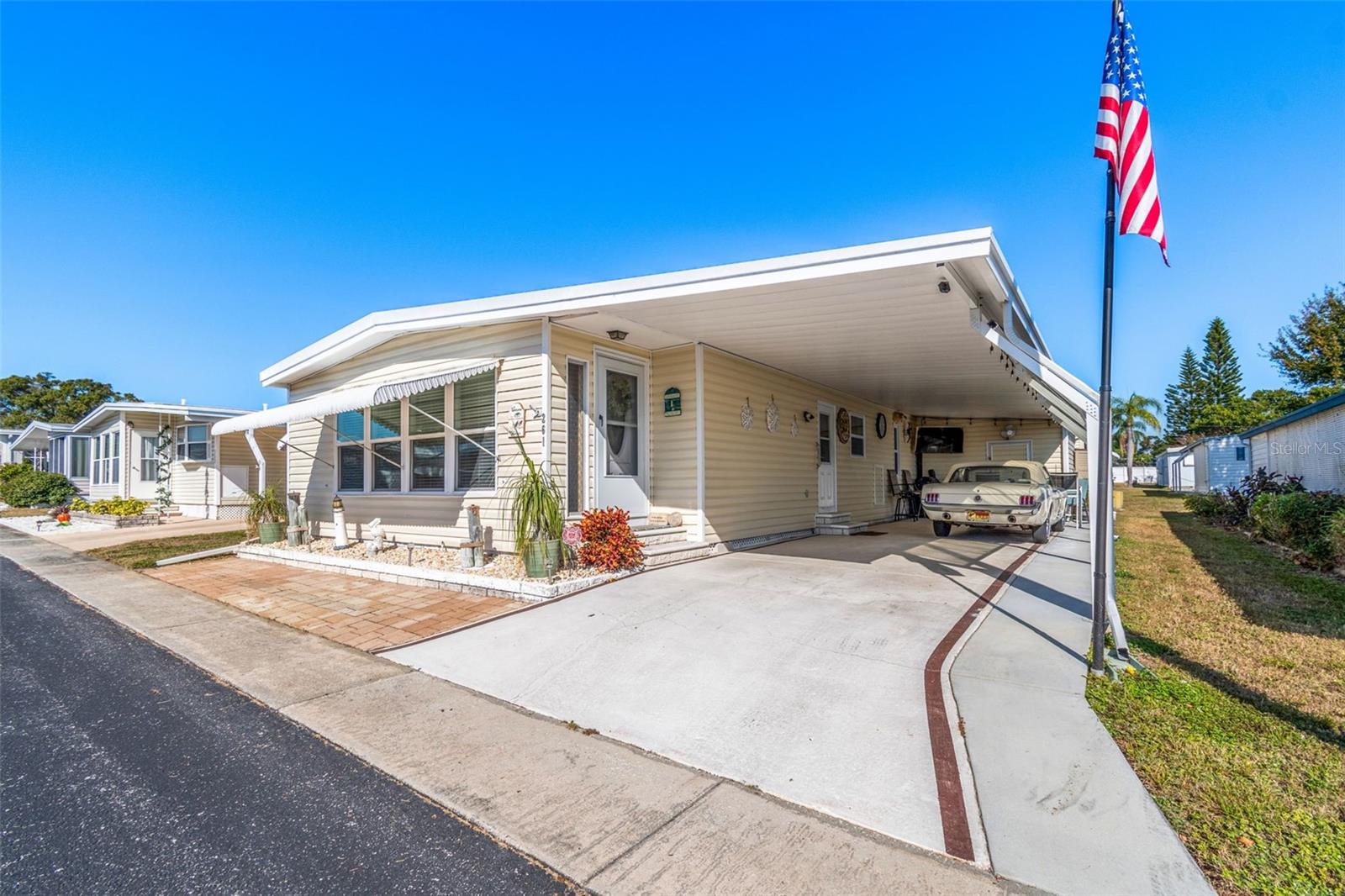 Welcome to the highly desirable Palm Hill Mobile Park, a fun and active 55+ community in Largo, FL. This updated and well-cared-for 1284 sq ft double-wide home is warm, welcoming, and designed for easy living. Thanks to two comfortable living spaces, a formal dining room, and two bedrooms and two bathrooms, there’s no shortage of room for guests, gatherings, or hobbies. The large attached utility/storage rooms provides convenient, ample storage  You’ll appreciate the many recent updates, including the roof (2019), under-home vapor barrier (2022), HVAC and ductwork (2024), and water heater (2025). The remodeled kitchen and bathrooms feature beautiful quartz countertops, and the home also includes double-paned windows, new carpet in the primary bedroom, a reverse osmosis system, and a widened carport for extra convenience. The location within the community couldn’t be better—you’re just a short walk from a clubhouse, pool, tennis and pickleball courts, bocce ball, and shuffleboard. Palm Hill even has its own nine-hole par-30 golf course with a Pro Shop, available to residents for a yearly fee. A full social calendar ensures you’ll stay as active and engaged as you wish all year long. The monthly HOA fee of $554 covers lawn care, water, sewer, trash, cable, and internet, keeping things simple. Plus, you’re only minutes from gorgeous Gulf beaches, great restaurants, shopping, and the lively downtowns of St. Petersburg, Safety Harbor, and Dunedin. This is a cash-only purchase, and the share price is included in the asking price. Schedule a tour today and don’t miss the chance to own this beautifully updated, move-in-ready home before the end of the year!