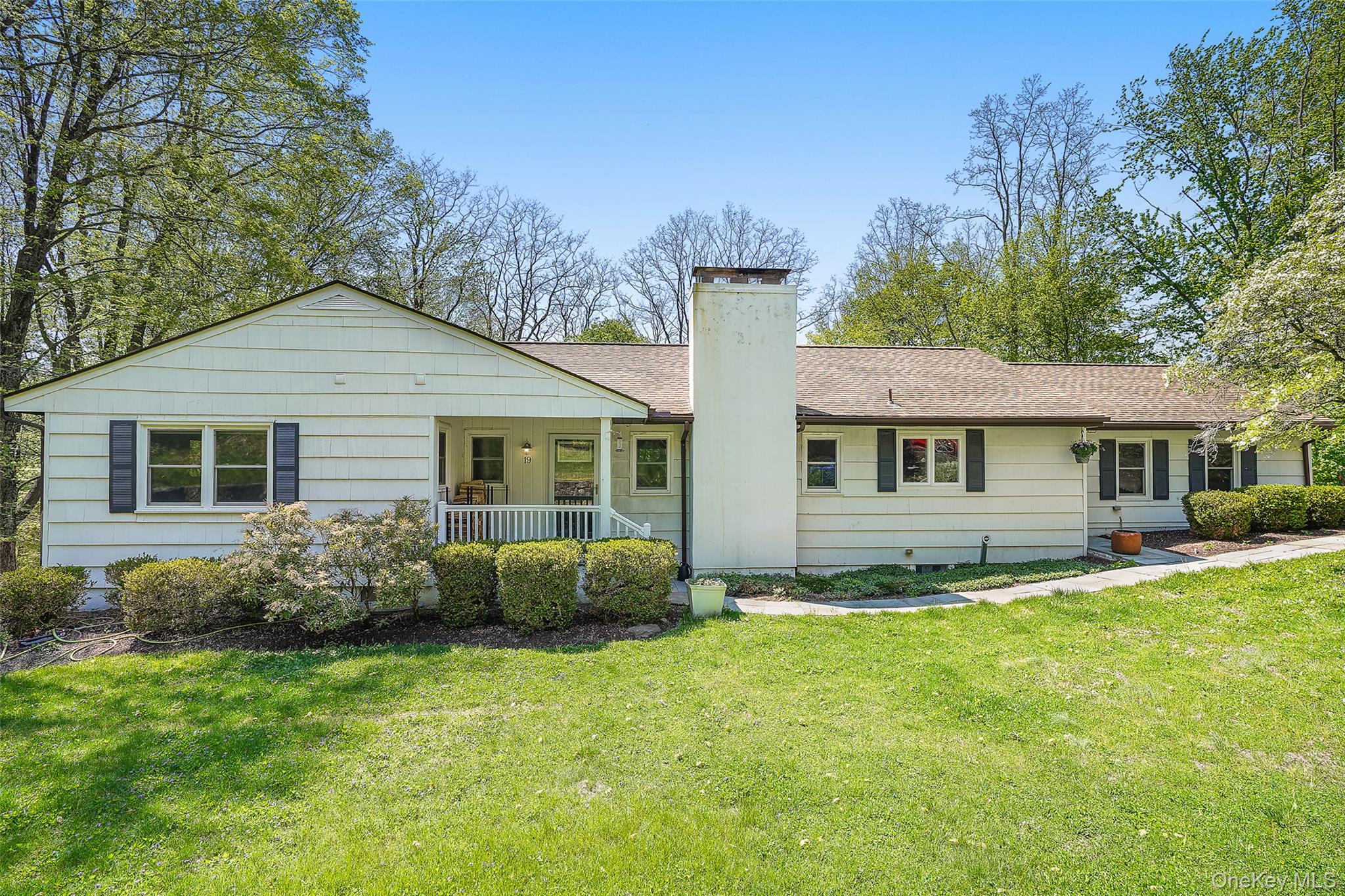 This classic 3 bedroom ranch offers an inviting open concept on a quiet no-through street. The main level features a primary bedroom with ensuite bath, two more bedrooms with full hall bath, a spacious front to back living room with fireplace that opens to a large light-filled dining area adjacent to an open kitchen with access to a large 2-car attached garage. A fully finished lower level with access to a large stone patio and rear yard offers endless possibilities. This level is highlighted by a large versatile open space perfect for media, exercise, and entertainment, and includes an updated spacious wet bar, a versatile bonus room/office with double glass doors, a 2nd fireplace, built-in shelving and a Murphy bed, a separate full bathroom, laundry room with washer/dryer and utility sink, utility room and additional storage. Recent additions and upgrades to the property include a whole house Generac generator, a Weil-McLain Ultra three passage boiler with Carlin burner, well water tank, exterior invisible dog fence, and all new window treatments. Convenient location to the North Castle town pool.