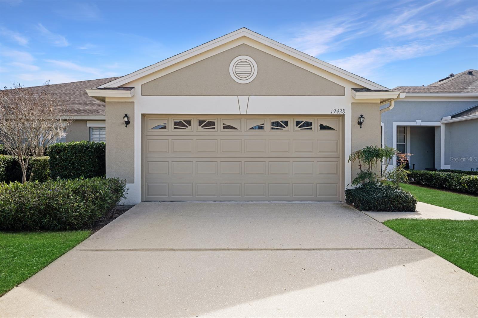 This villa is located in Weymouth village of Oakstead, a premier community known for its resort-style amenities, strong community feel,and family-oriented environment in a growing but convenient part of the Tampa Bay area.This single-story attached villa offers a low-maintenance, pick up and go lifestyle. Features an open floor plan with 2 bedrooms (plus a den/office that can serve as a 3rd bedroom) with attached 2-car garage.This stellar community is located 7 miles from Tampa Premium Outlets, Costco, PopStroke, many great restaurants and entertainment centers to keep you close enough for errands but far enough away to enjoy peace and quiet. This villa is ideally located 2 miles from Sunlake High School  in the heart of Land O’ Lakes. Pick any stage of life and this villa suits your needs; an easy-to-manage home, a place to grow into, or a smart investment. Walking inside the front door, you are in the living room/dining room combo with tons of natural light streaming in from the lanai and side windows. Follow the flow to the back of the house and find the primary suite with en-suite bathroom featuring his and hers walk-in closets, dual sinks, a separate tub and shower, a private water closet, and linen closets. Turn left when you walk in the house and find the shared dining room space with a serving window to the kitchen that includes an eat-in space decorated with plantation shutters. The 3rd bedroom is right off the kitchen that includes the other split bedrooms and a full bath. Laundry closet located on the far wall of the kitchen and includes extra storage. A must-have 2-car garage keeps all toys and tools safe and protected. Conveniently located on a cul-de-sac, this home is safely guarded and tucked in a well maintained community. Looking forward to hosting your visit soon.